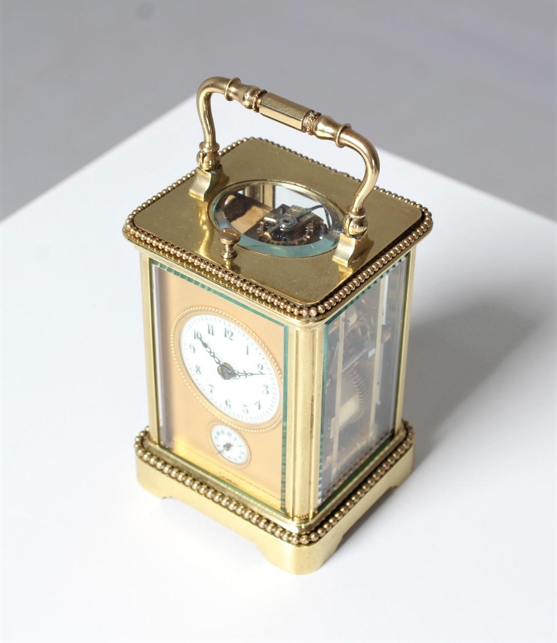 Antique travel clock, Carriage, Pendulette de Voyage.

France
brass, glass
around 1900

Dimensions: H x W x D: 10 x 7 x 6 cm

Description:
Beautiful small travel alarm clock in brass case.
Half hour and hour strike on sound spiral. Hour