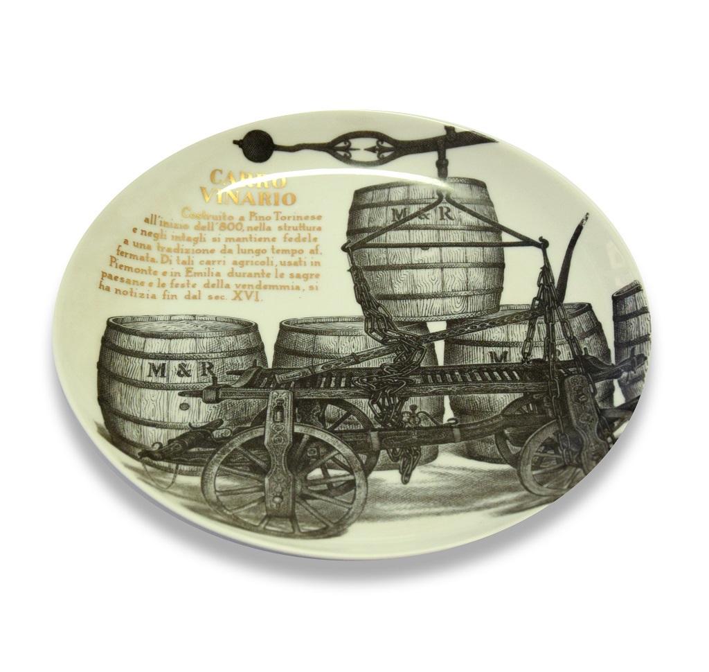 Carro Vinario is a silk-screened porcelain plate, designed by Piero Fornasetti for Martini & Rossi in 1960s.

In excellent conditions: as good as new. 

Black and white ceramic Fornasetti wall plate, representing wine-carriage, an ancient means