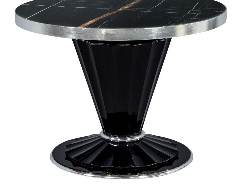 Carrocel custom Art Deco style marble-top foyer hall table. This hall table is an inspiring Carrocel custom creation, the table has a sculpted fluted pedestal that flows onto a tulip designed base. The perimeter of the top is apportioned with hand