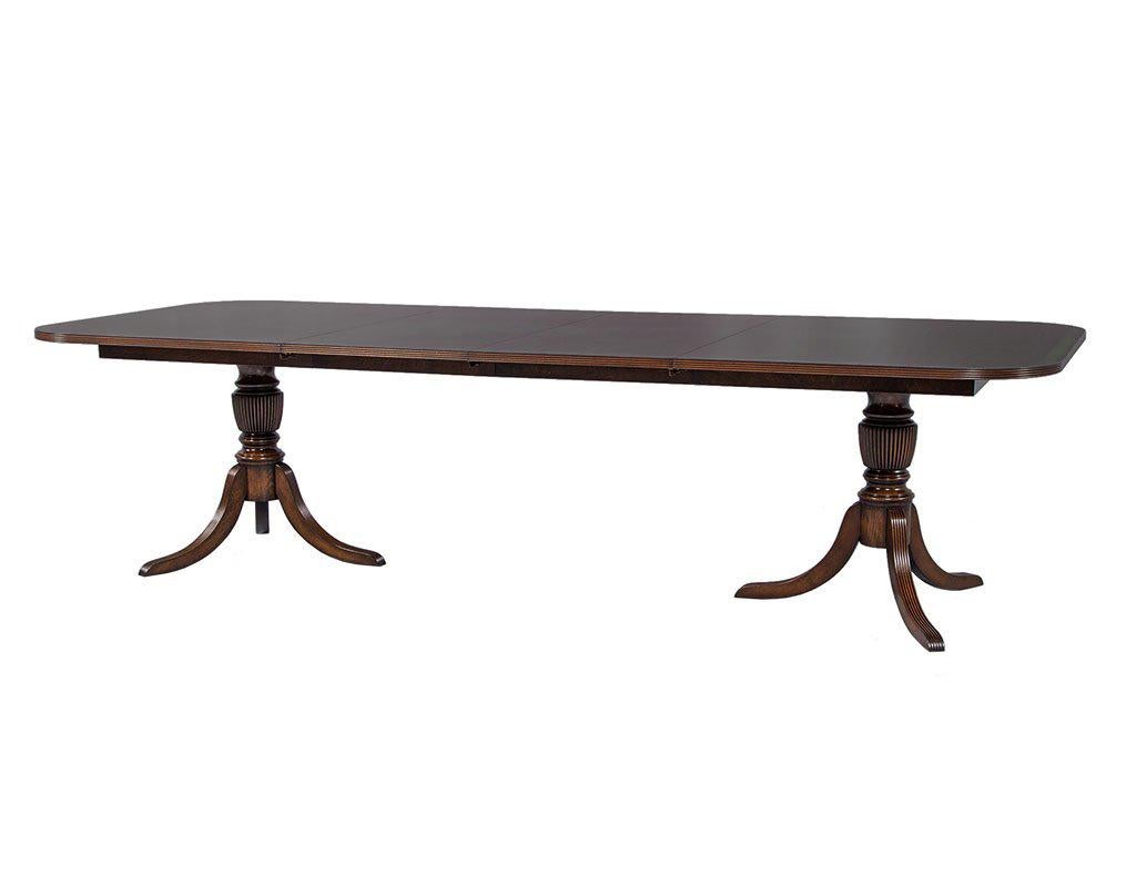 Canadian Carrocel Custom Flamed Mahogany Dining Table with Duncan Phyfe Style Pedestals