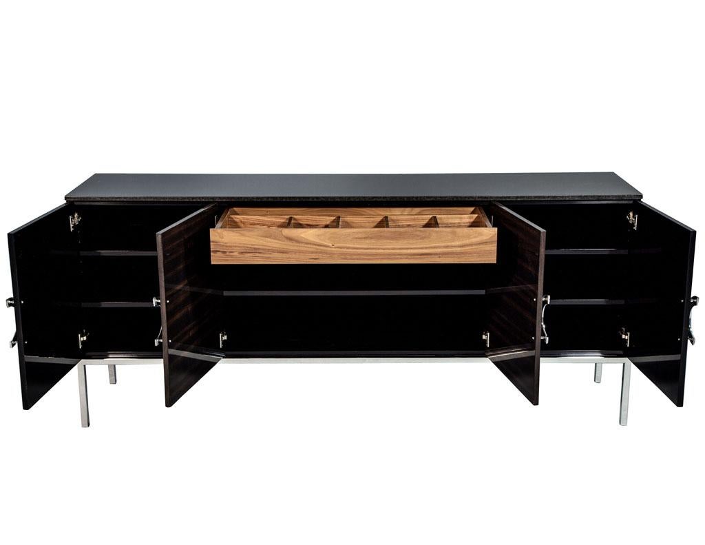 Carrocel custom modern black lacquer walnut sideboard buffet credenza. Modern style sideboard, credenza, buffet. Handmade by our master craftsmen, this piece has a stunning combination of hand polished walnut and black lacquer, accented by polished