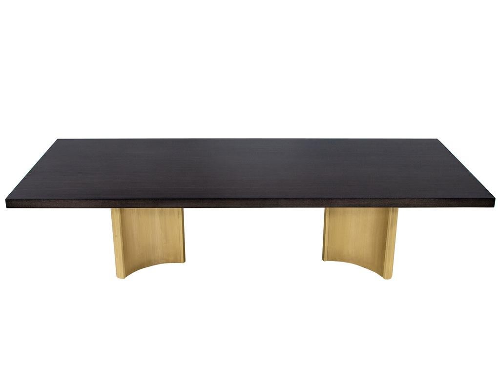 Carrocel Custom Modern Oak dining table with brass Eiffel Pedestals. Beautiful rift-cut oak top with textured satin finish in a warm dark gray finish. Featuring our newly designed Eiffel curved brass pedestals. All hand crafted here in Toronto,