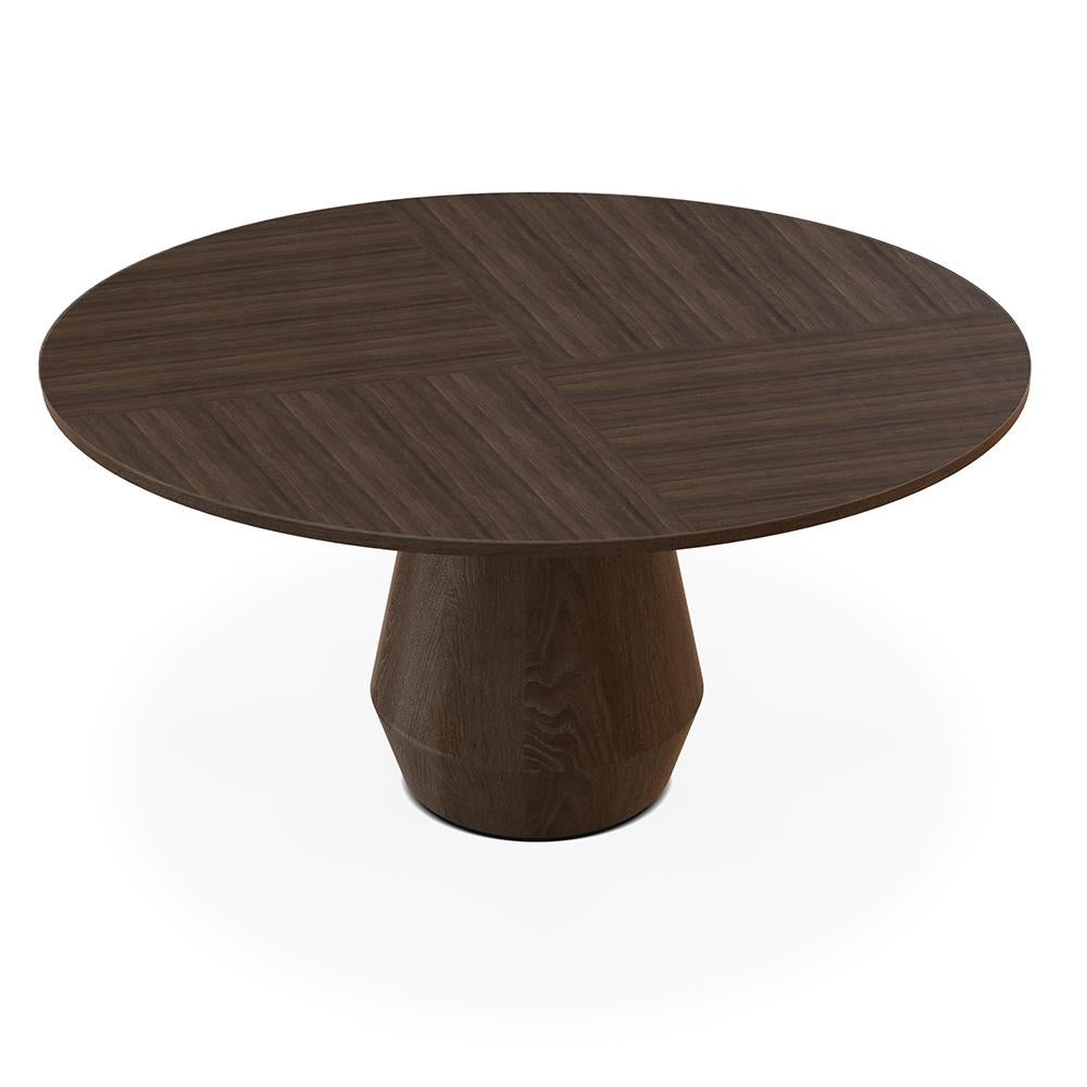Charlotte dining table by Collector
Materials: tabletop in sub-divided oakwood veneer. Base in oakwood
Dimensions: Ø 160 x H 77 cm

A round dining table distinguished by the particular structure in solid wood. The three legs are joined to form the