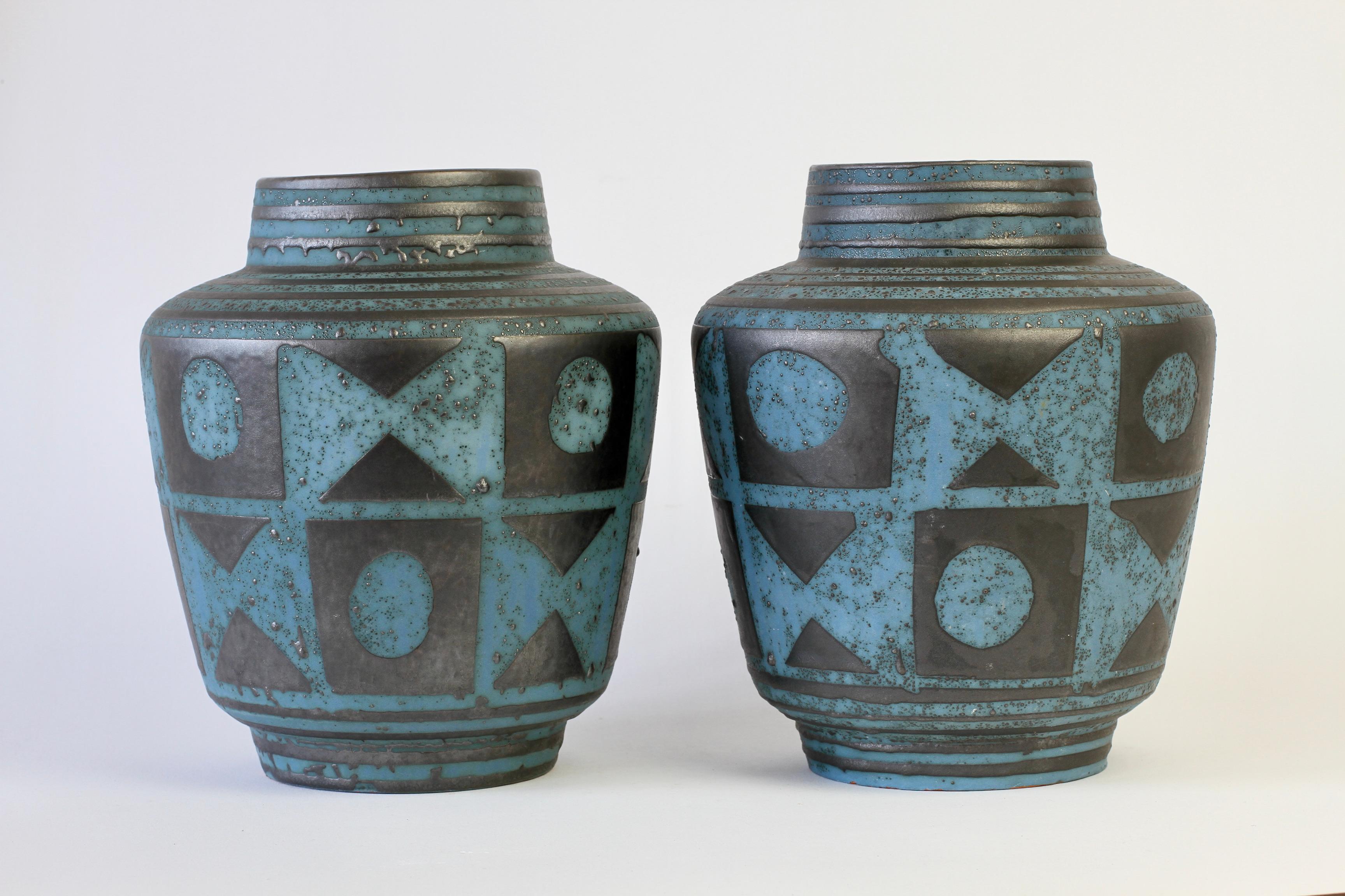 Beautiful midcentury pair of West German vessels or vases by Carstens Tonnieshof as part of the 'Ankara' range produced circa 1958 in graphite dark grey and blue. Perfect to have a pair for over the mantlepiece of a fireplace or surround or a dining