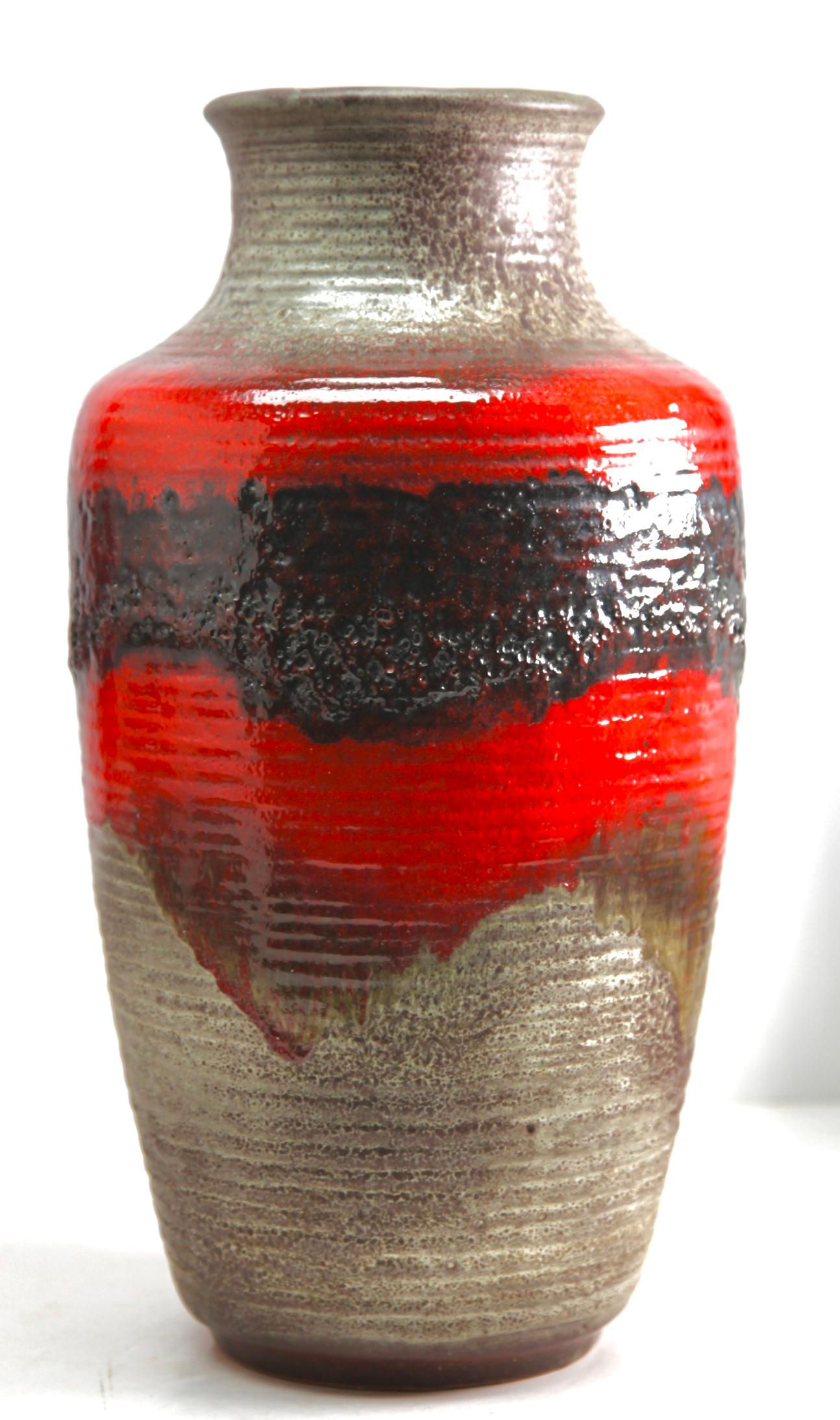 Carstens Tonnieshof
Classic fat lava red drip-glaze on charcoal background. Floor vase 
Glazed pottery.
Stamped on the base. 7901-45 W-Germany.
Measures: 46 x 24 cm 4.3 kg
The piece is in excellent condition and a real beauty.
  
   
   