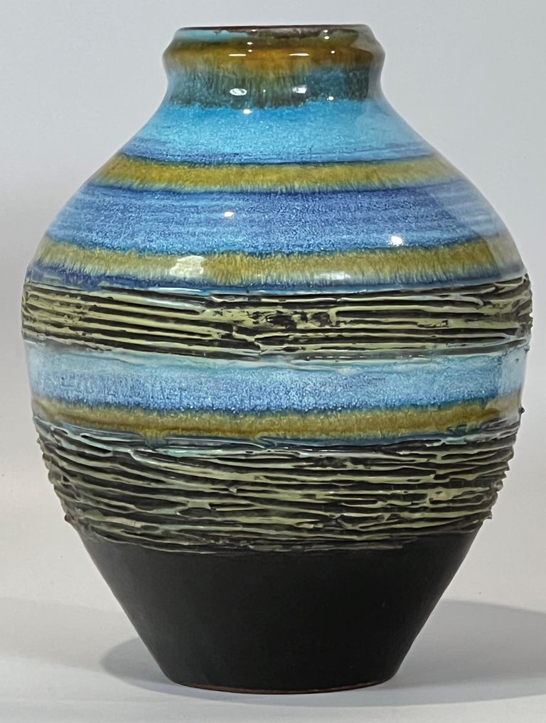Examples of this glaze line are hard to find and textured ones downright rare. The combination of blue and gold bands turns up in the late 60's with the super rare Boutique and occasionally Atelier items and I have also seen one example with a