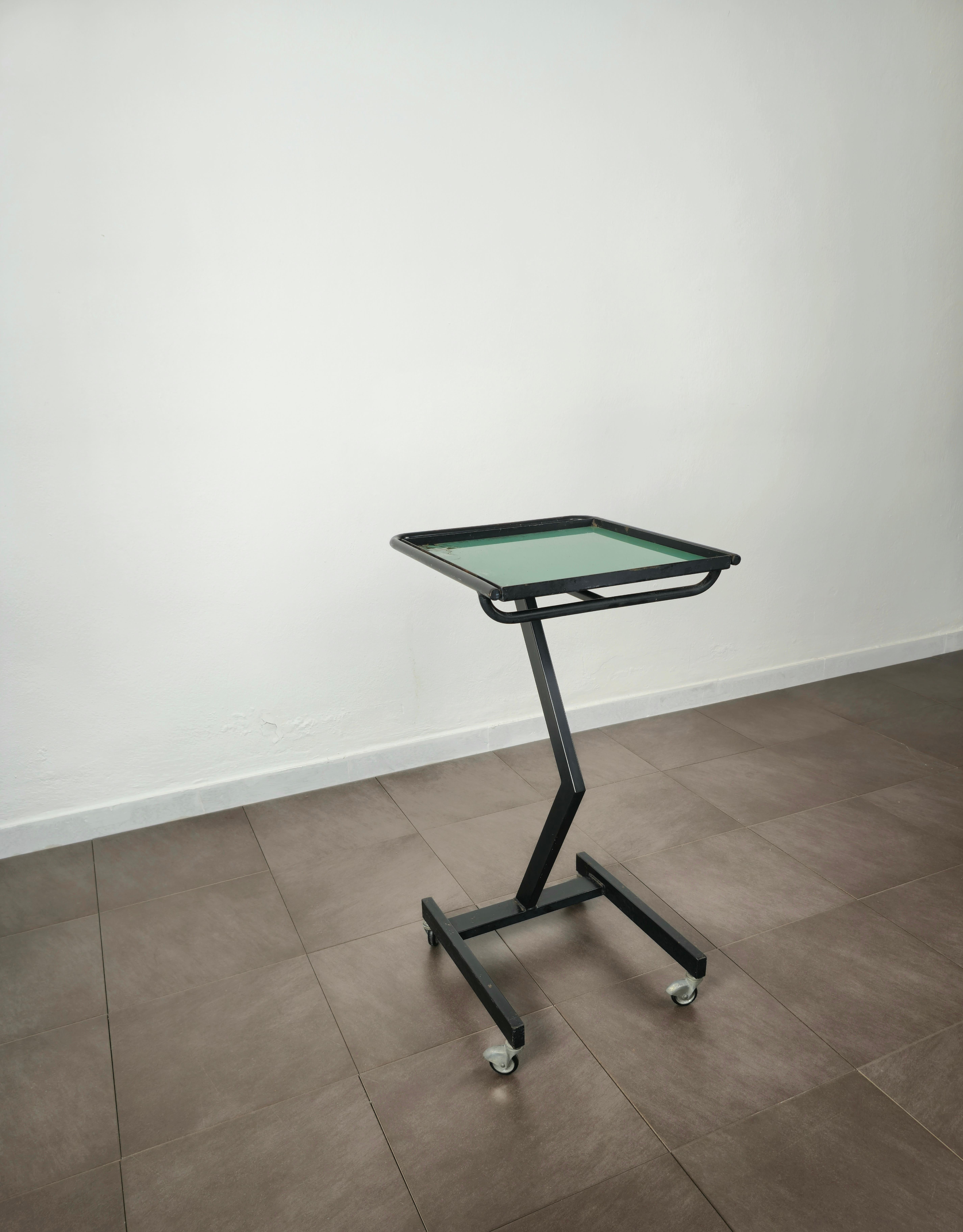 Food trolley/cart with particular shapes made of black enamelled metal with glass top. Made in Italy in the 70s.



Note: We try to offer our customers an excellent service even in shipments all over the world, collaborating with one of the best