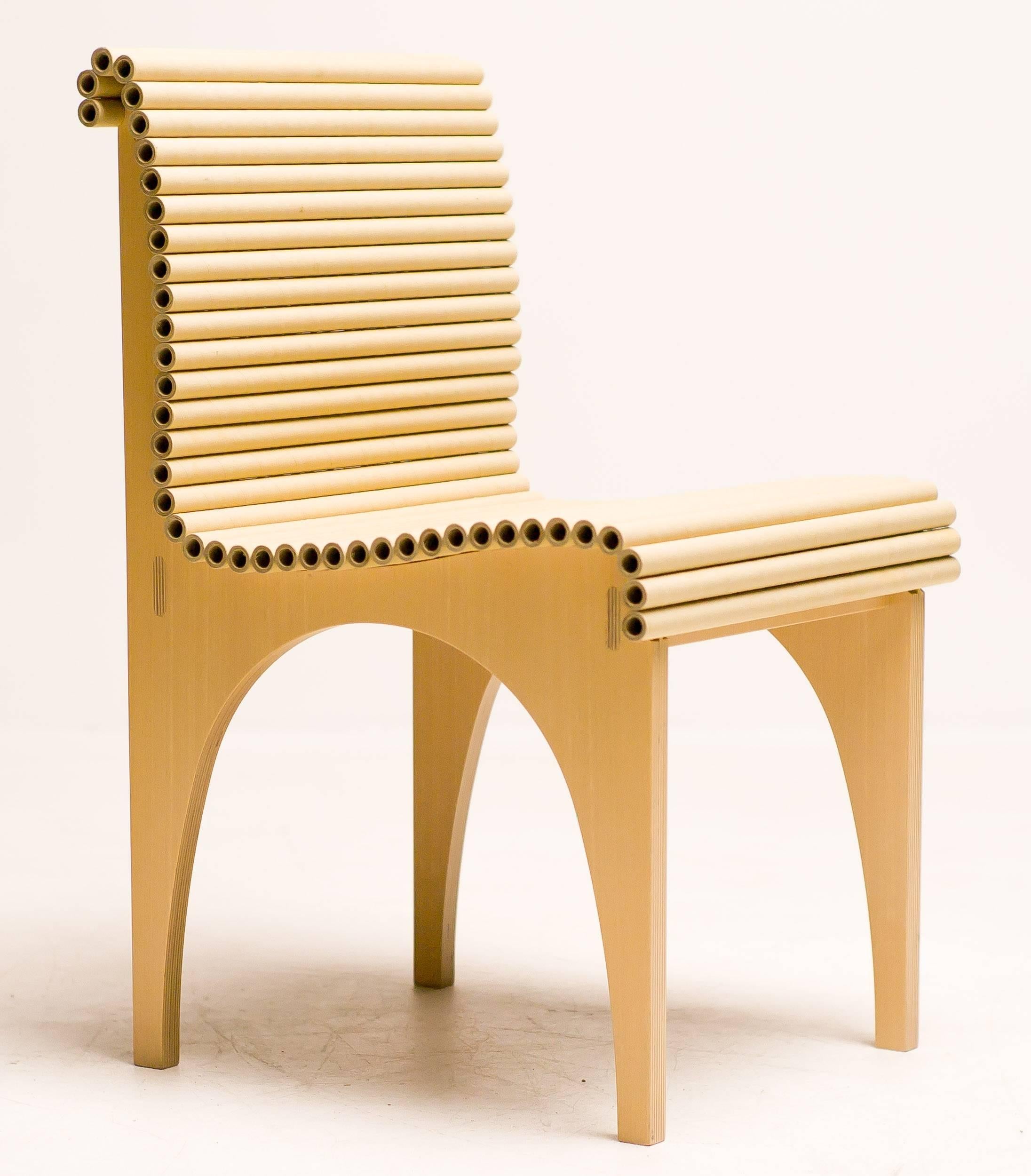 This elegant Carta chair was designed by Shigeru Ban for Cappellini in 1996. Defined by it's use of unconventional materials, the seating area of the chair is composed of recycled cardboard tubes, the chair presents characteristic Japanese design