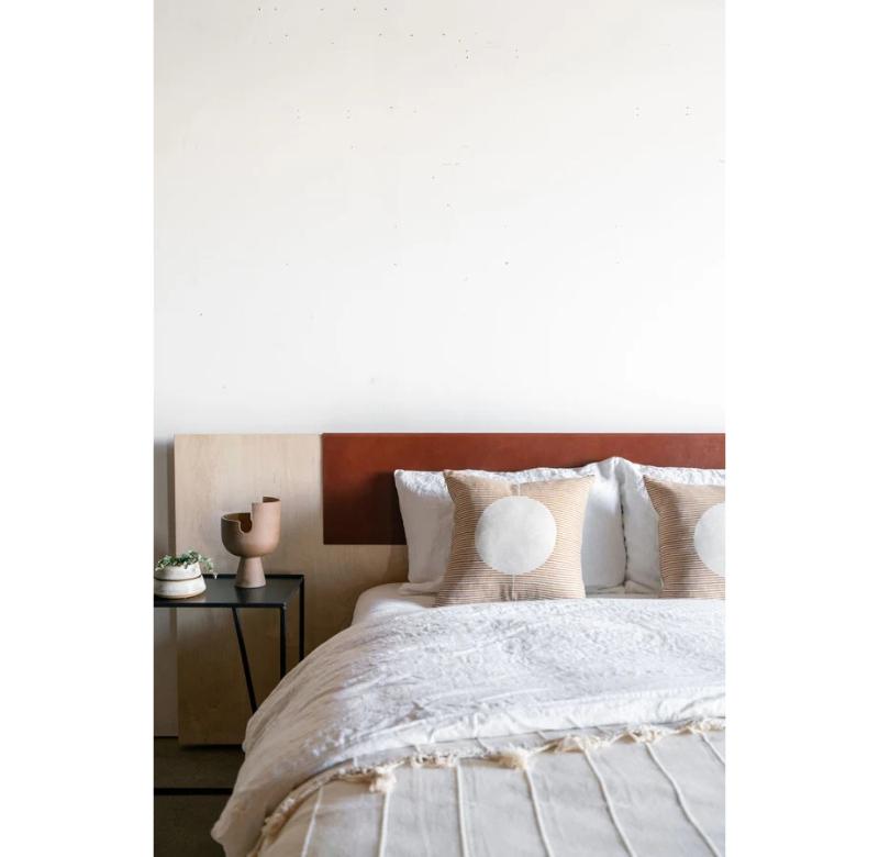 The Carter Bed is handcrafted from beautiful bleached maple and accented with a leather panel at the center of the headboard. The design's clean lines and low profile give a modern feel while the warm wood grain and soft leather add an organic