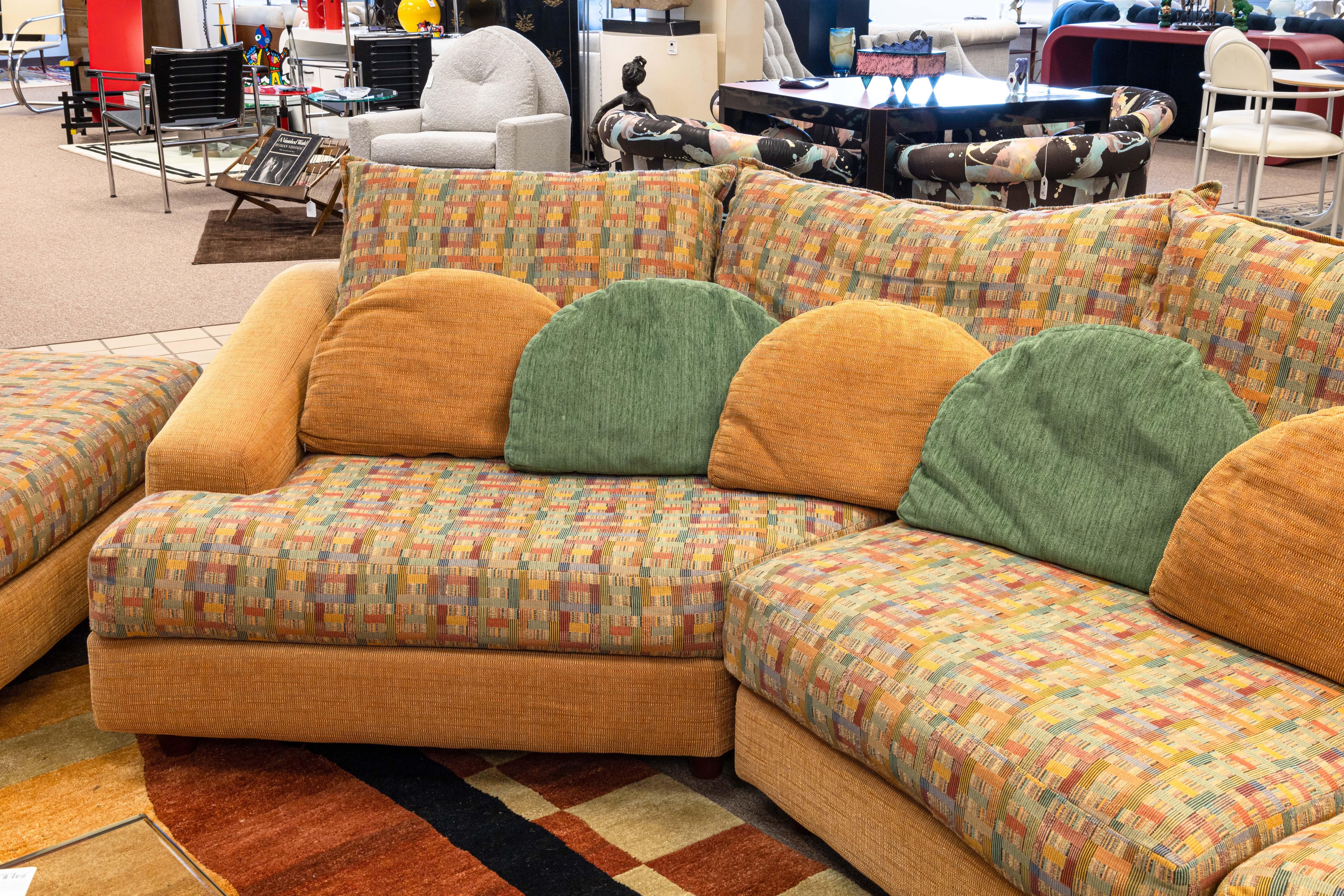 A Carter furniture multicolored sectional sofa with ottomans. An incredible sectional with a super fun postmodern/contemporary modern design. This piece features four pieces: two sofa pieces, and two ottomans. This sectional features a multicolored