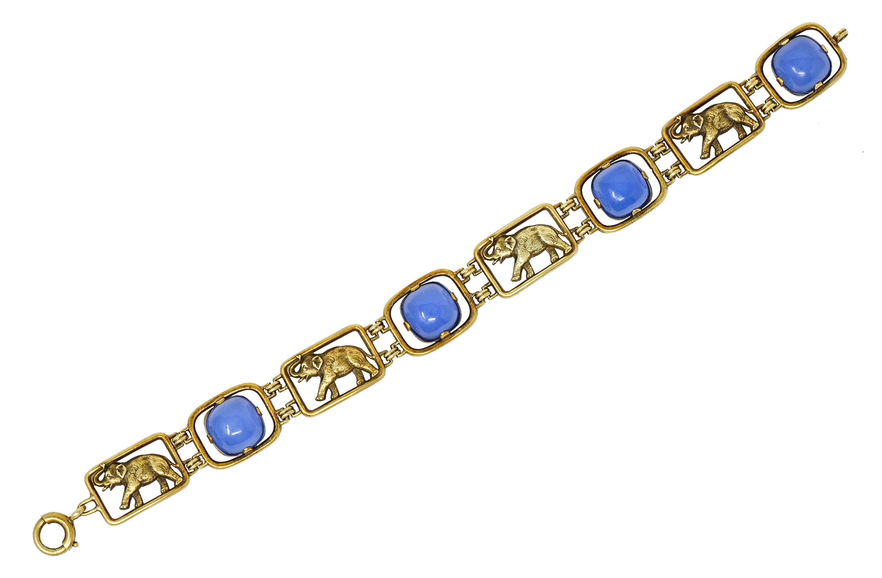 Bracelet features pierced rectangular links and completes as a spring ring clasp

Some links are highly rendered to depict elephants with an upturned trunk

Alternating with sugarloaf cushion cabochons of violetish-blue chrysoprase

Very