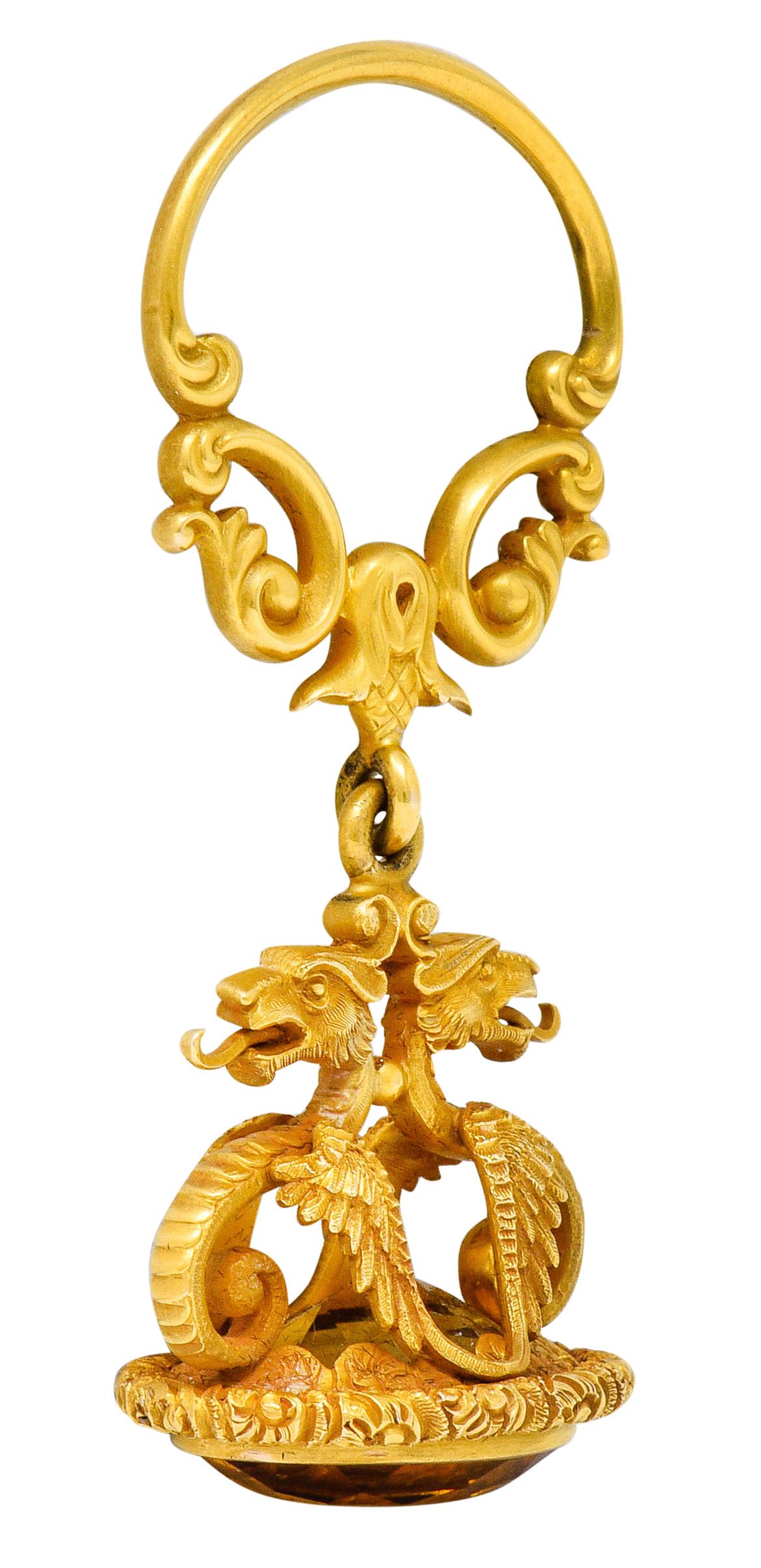 Pendant is designed with a whiplashed door-knocker style bale that terminates as a thistle motif

Suspending a fob comprised of two mirrored dragons on a deeply engraved floral base

Extraordinarily detailed with flickering tongues, scrolled