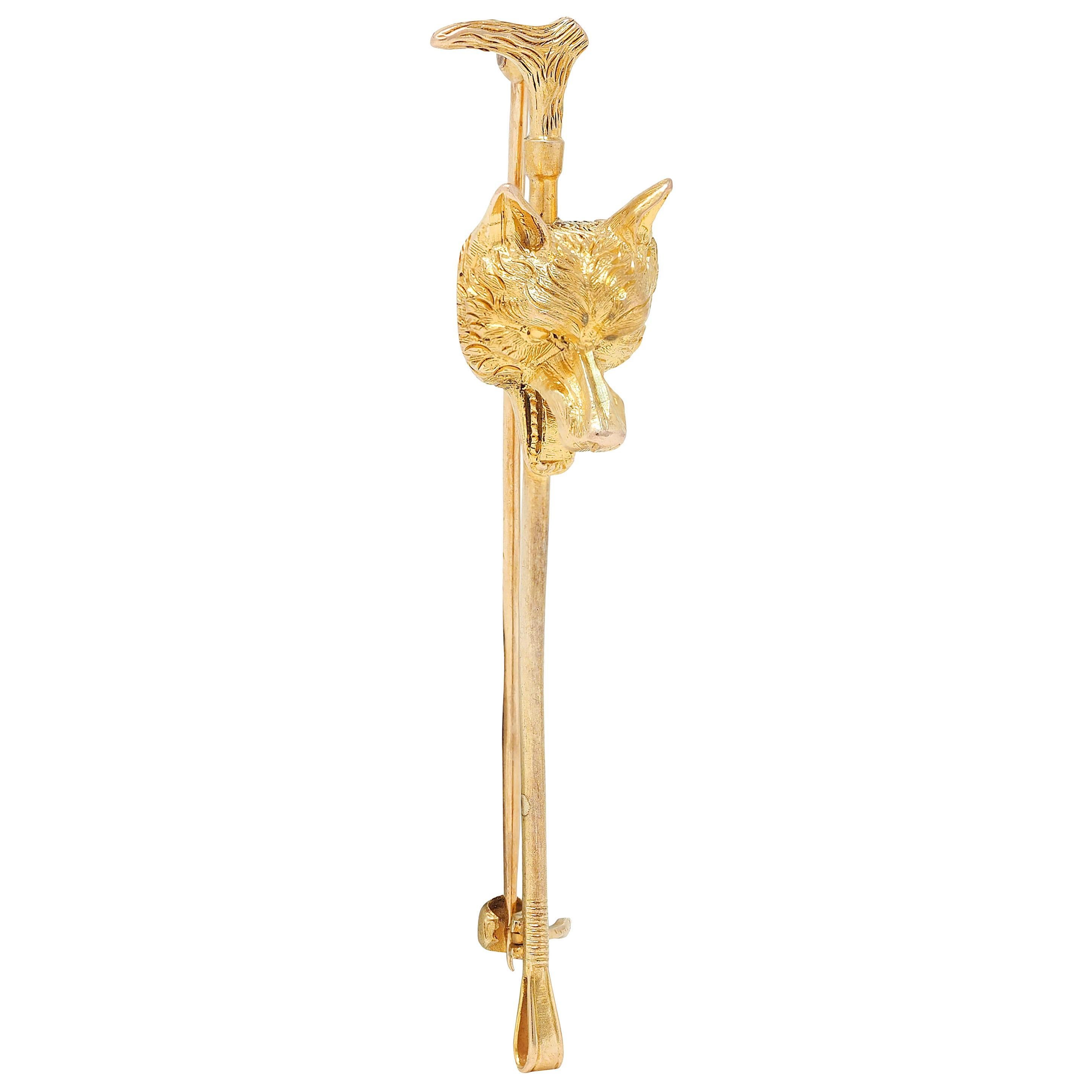 Designed as a highly rendered fox head atop an antique style riding crop
Fox features perked ears with open mouth
Crop has a wooden handle and looped end
Engraved with fur and woodgrain texture
Completed by hinged pinstem with locking