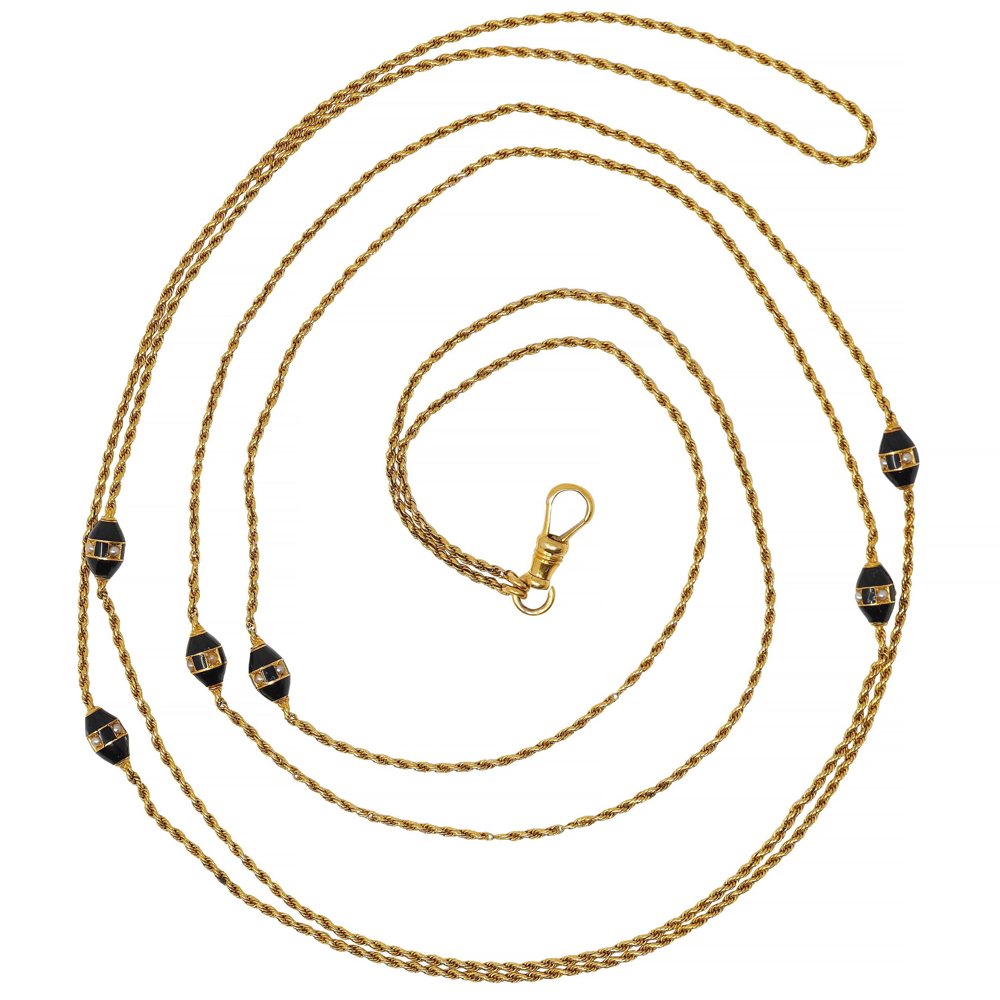 Designed as a 1.5 mm rope chain with six oval-shaped bead stations 
Glossed with opaque black enamel throughout 
Centering an alternating pattern of enamel and seed pearls
Pearls measure 1.5 mm round - bead set in gold squares 
Cream to gray in body