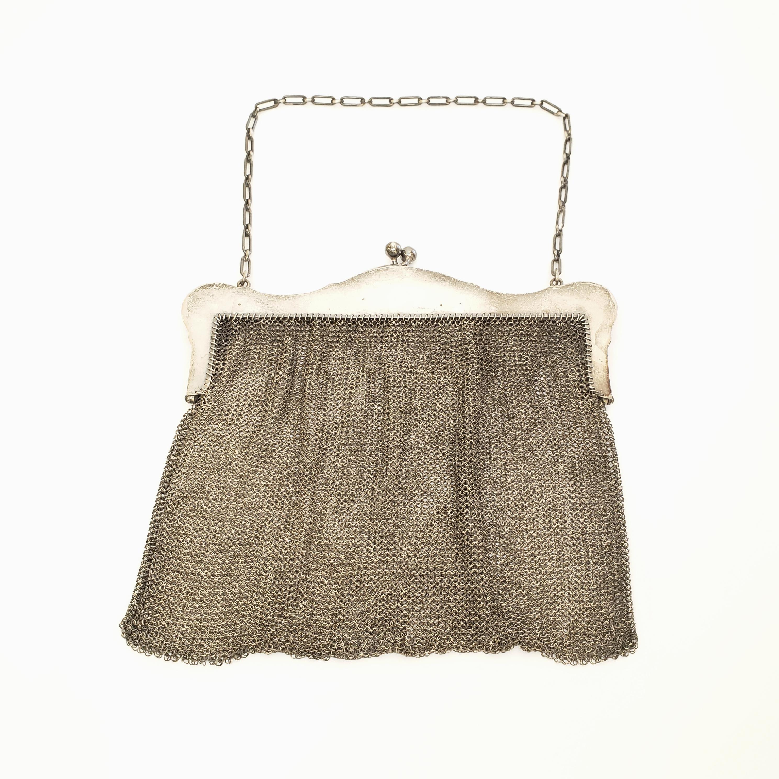 Antique sterling silver mesh coin purse with chain strap by Carter Hale & Co of Newark, NJ from 1841-1920.

Beautiful with its original warm finish, 