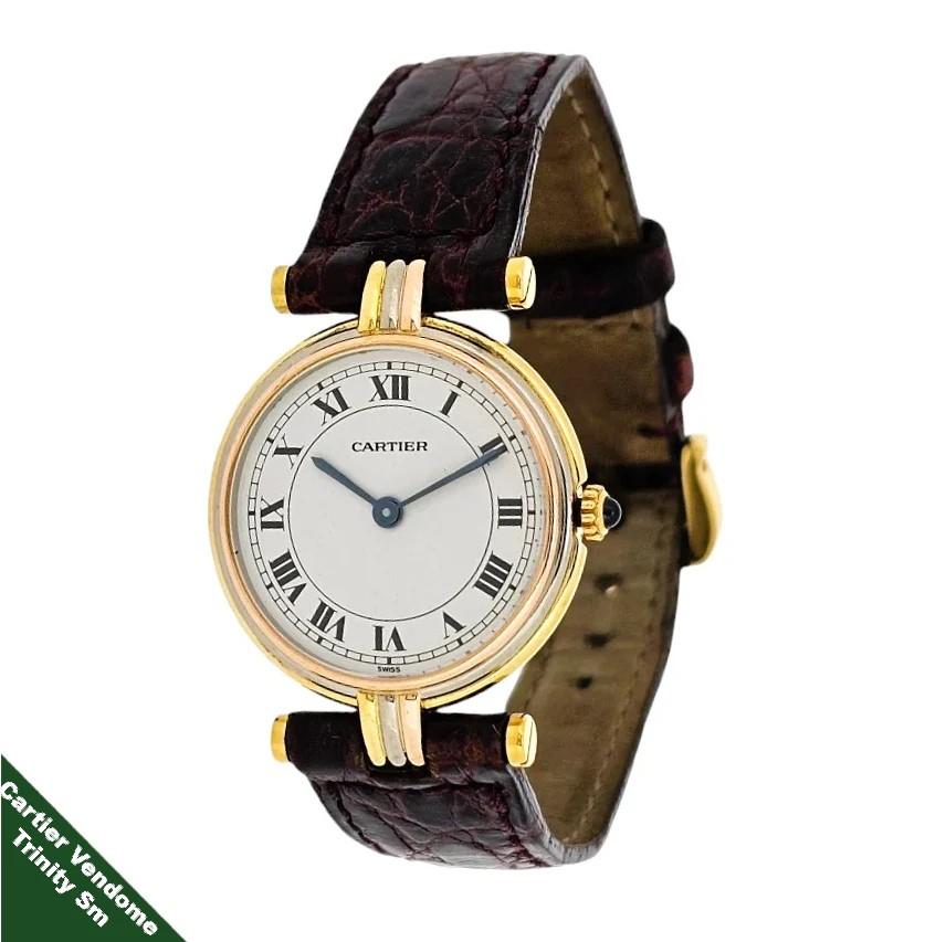 Carter Paris Trinity Vendome Watch, Ref. 11034 .  The watch is made in three 18 Karat colors,  White, Yellow and Rose.  The watch is measuring  24 mm in diameter x 32 mm long to strap bar. The watch is fitted with a stirrup style center lug for