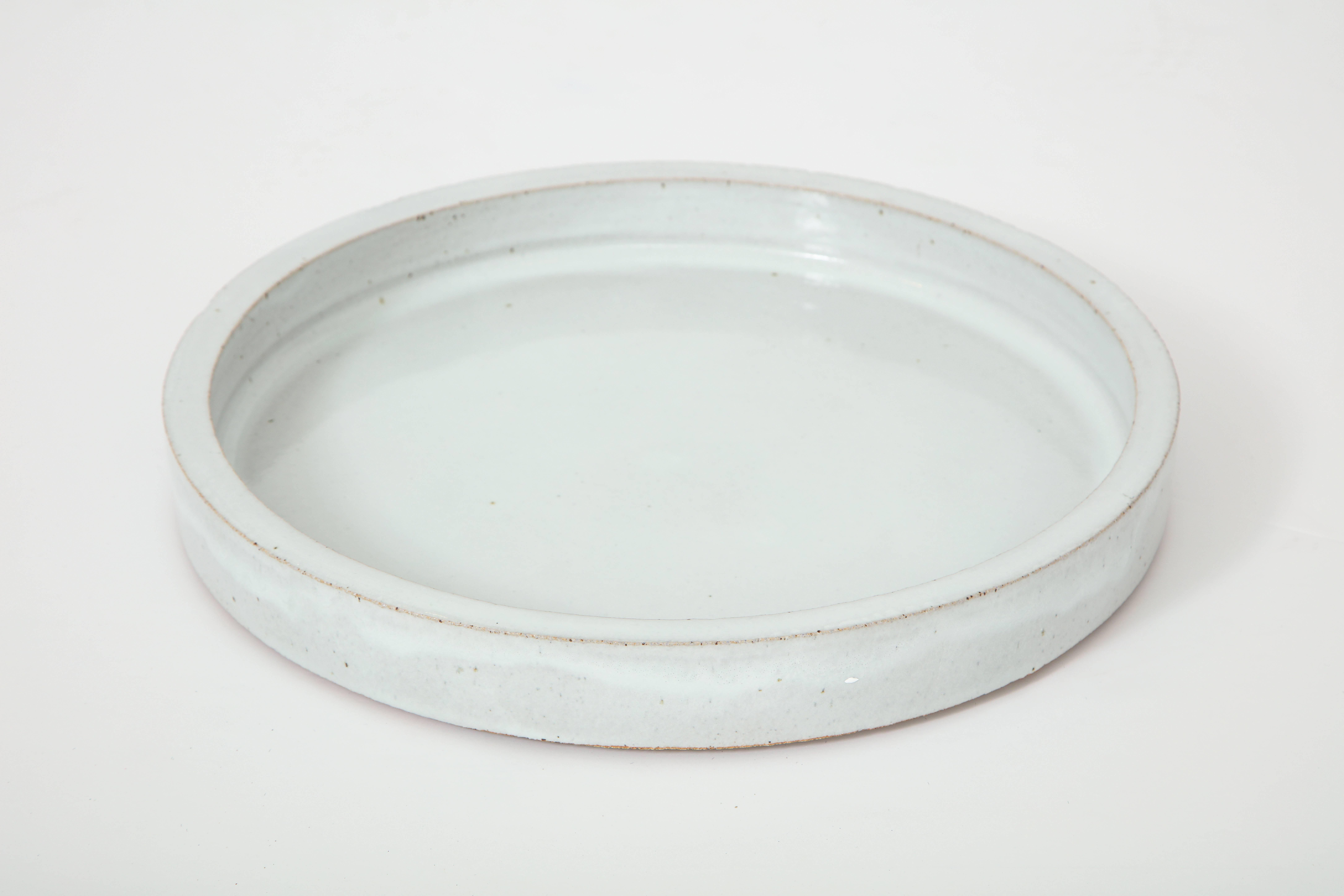 Richard Carter operates a studio and artist residency in Napa Valley. In addition to his ceramic art he also creates a selection of home goods. At our shop we’ve chosen to carry a selection of his porcelain crackle glaze butler trays and vases that