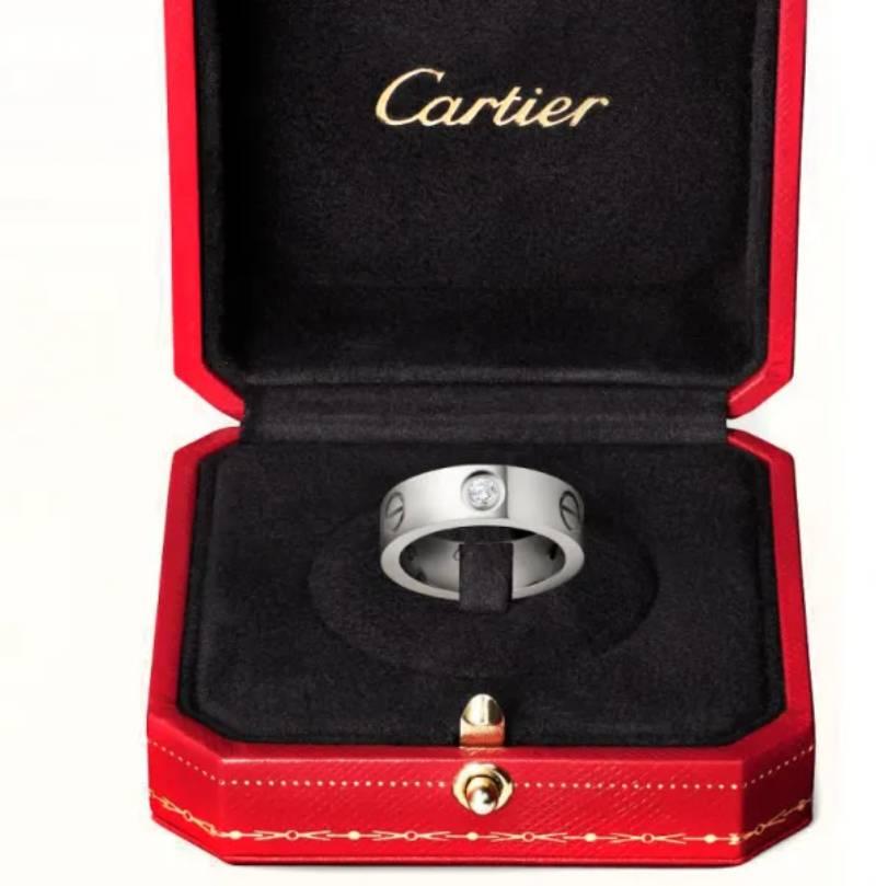 This exquisite Cartier Love Band is a timeless embodiment of elegance and commitment, meticulously crafted in luxurious platinum. A creation from one of the most iconic jewelry collections in the world, the Love Band speaks to enduring style and
