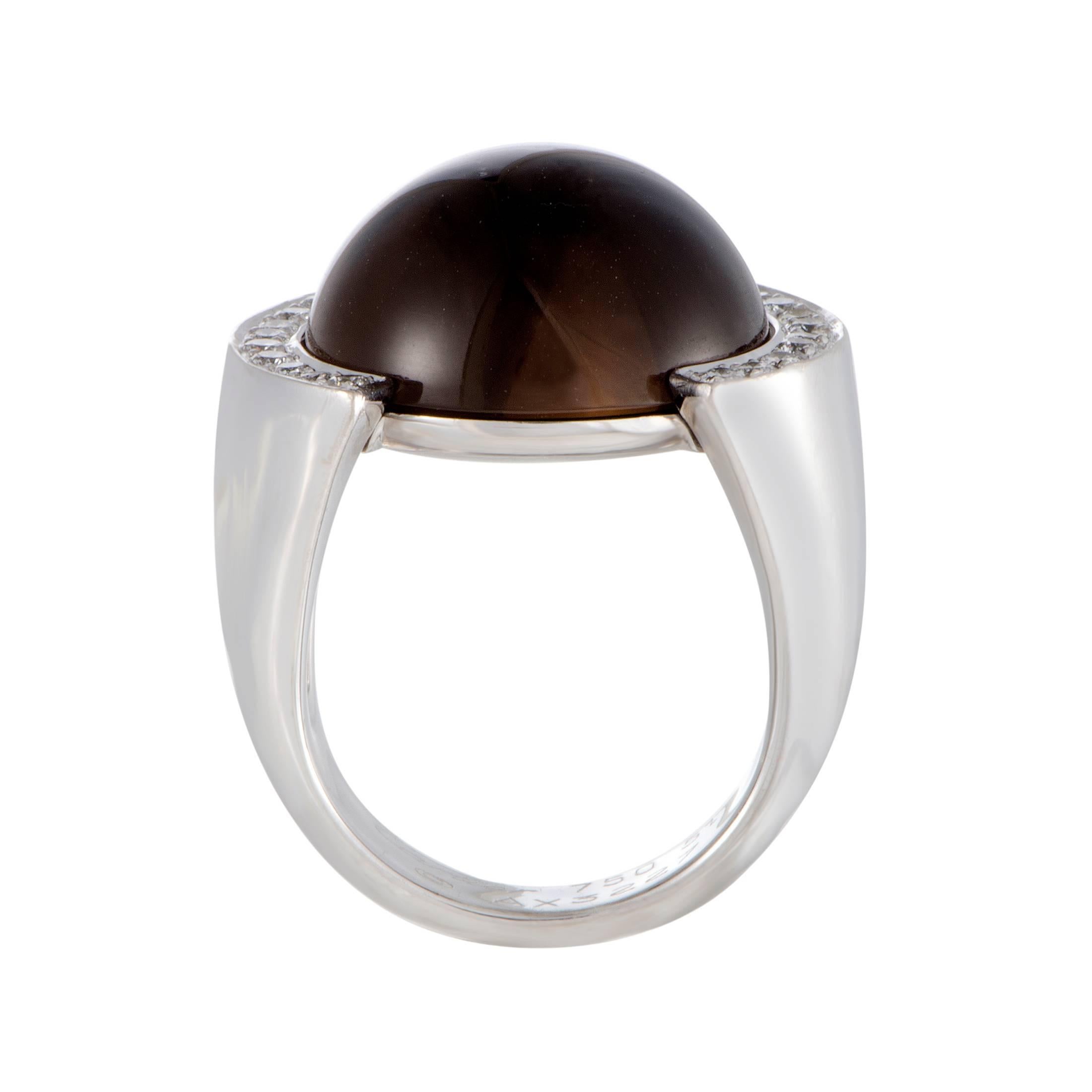 Perfectly contrasting the immaculate sheen of gracefully shaped 18K white gold and the marvelous smooth surface of delightful smoky quartz, the 0.50ct of diamonds produce a dazzling visual effect in this remarkable ring from Cartier.
Ring Size: