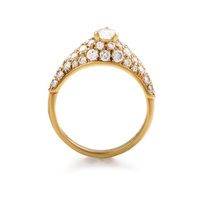 This splendid luxurious Cartier piece is remarkably made from 18K yellow gold and lavishly set with 1.50 carats of diamonds making a wonderful base for the spectacular 0.62ct pear-shaped main stone.
Ring Size: 5.25 