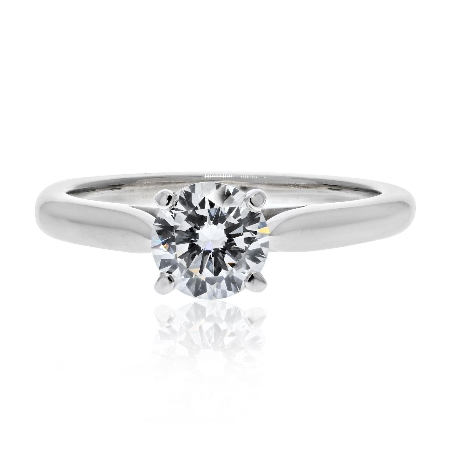 Classic diamond engagement ring by Cartier. Elegant four prong setting with a 0.65 carat round brilliant cut diamond. 
GIA certified G color, VS2 clarity. 
Finger size 4.5.