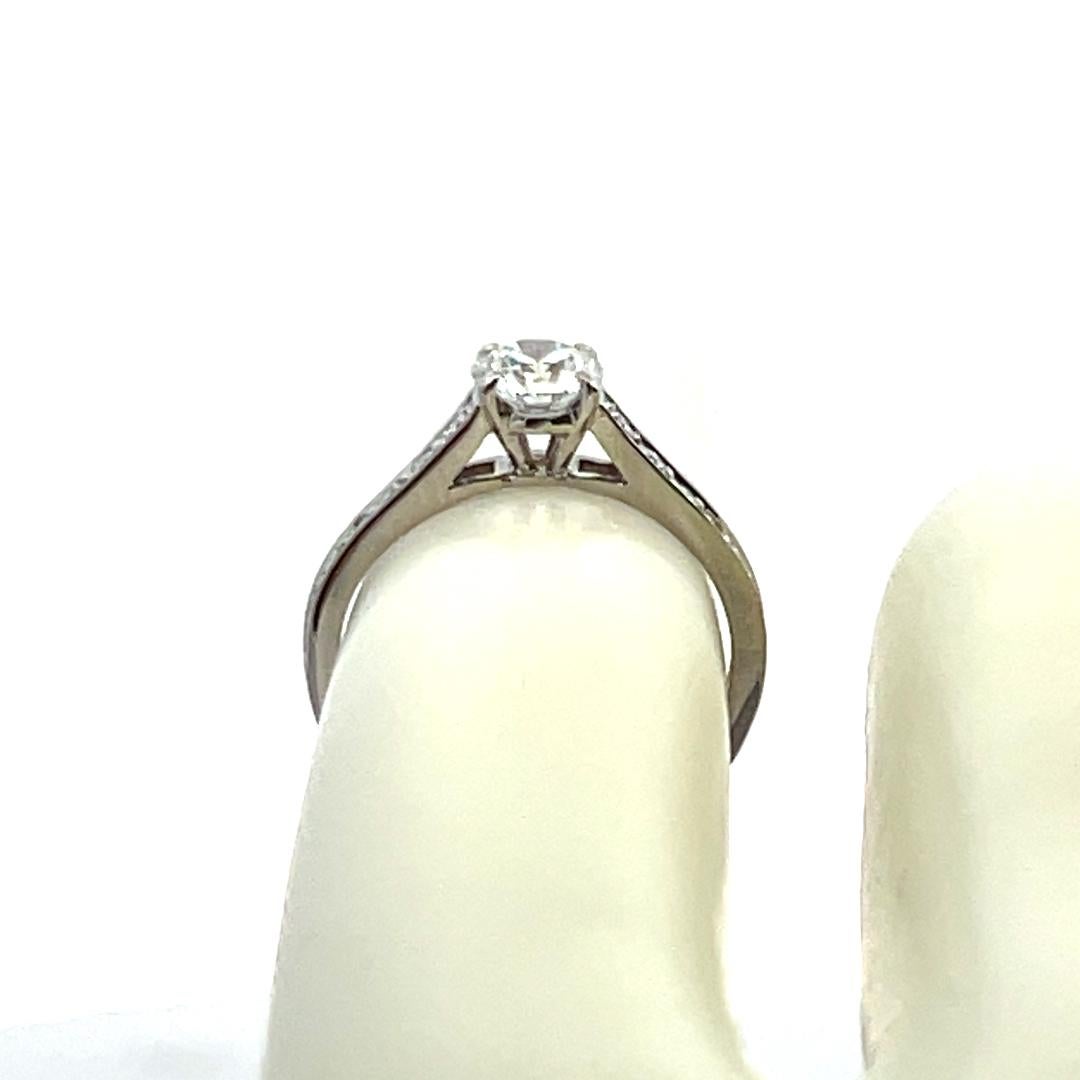Cartier 0.83 Carat Round Brilliant E VS1 Diamond Platinum Engagement Ring For Sale 4