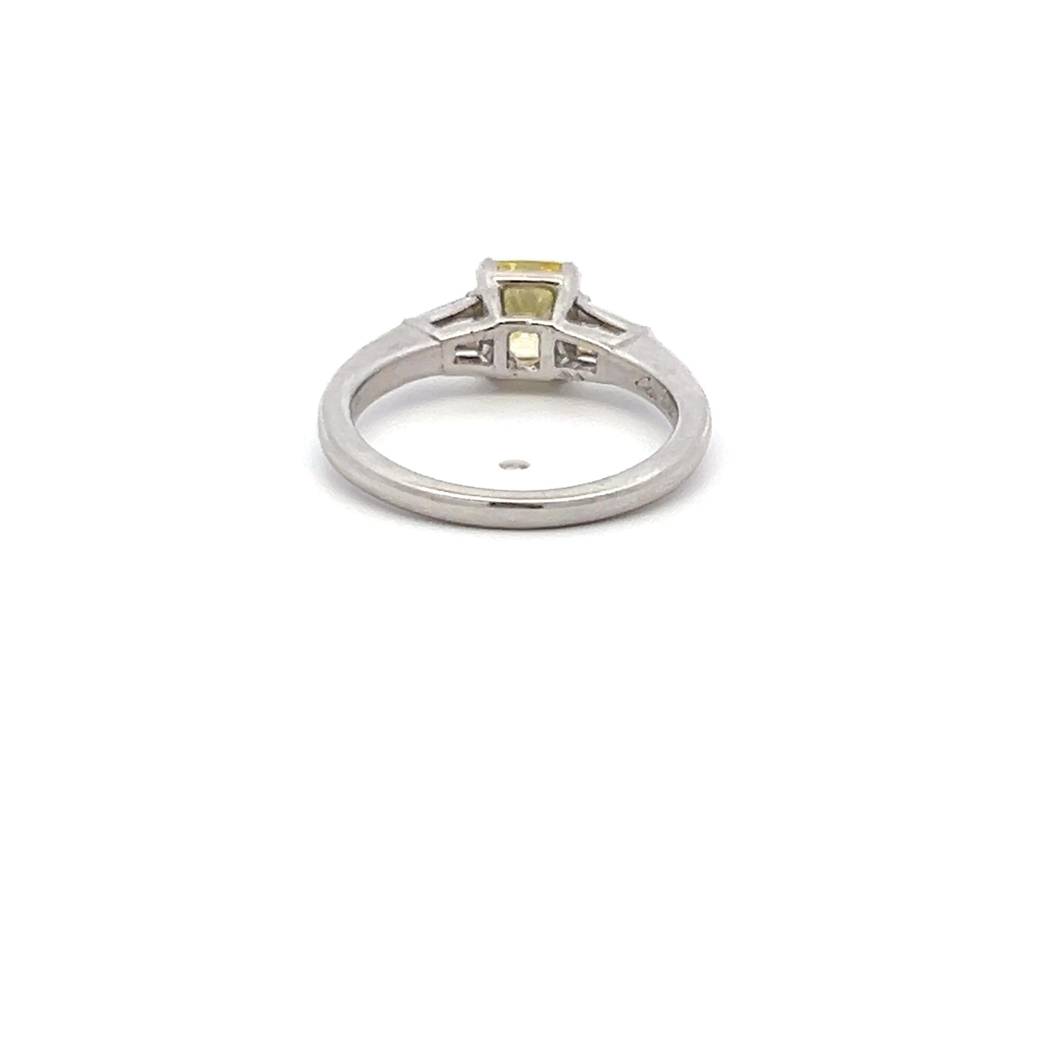 Radiant Cut Cartier 0.91 Carat Fancy Vivid Yellow VS2 Diamond Platinum Engagement Ring For Sale
