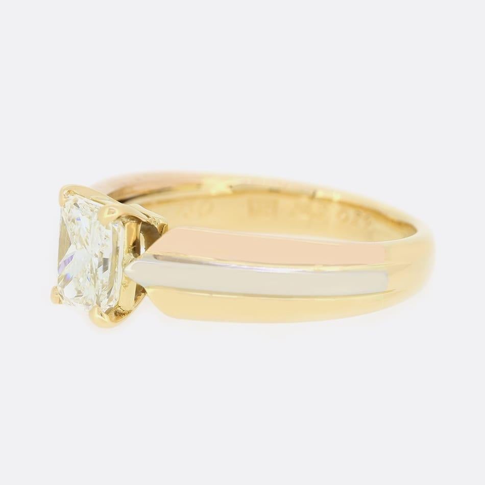 This is a truly stunning diamond engagement ring from the luxury jewellery designer Cartier. The ring features a 0.92 carat radiant cut diamond that sits above a triple colour gold band in a 4 claw mount. 

Condition: Used (Very Good) 
Weight: 4.8