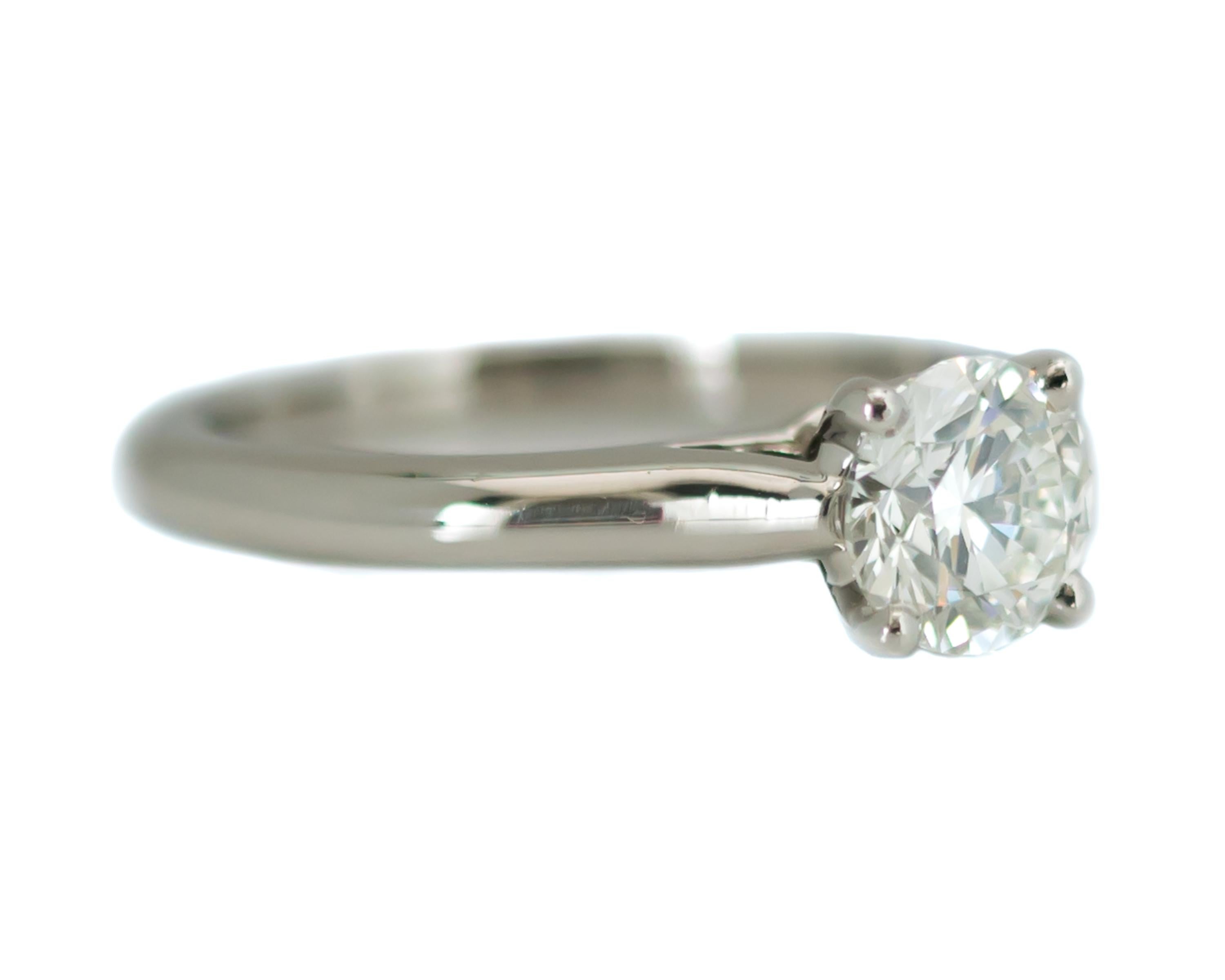 Cartier Platinum & Diamond Solitaire Engagement Ring

0.93 carat Round Brilliant Diamond Solitaire
Platinum Setting
Cartier Size 52
U.S. Size 6
Shank is 2.0 millimeters wide

*see our other listings for the Matching Cartier Platinum Wedding Band -