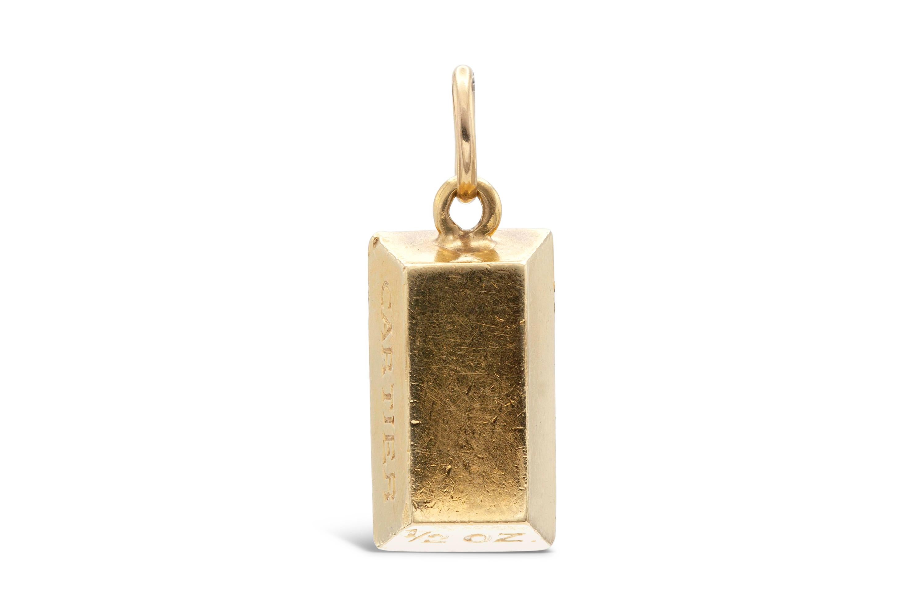 18K yellow gold bar weighing 1/2oz, wearable as a pendant. Signed Cartier.