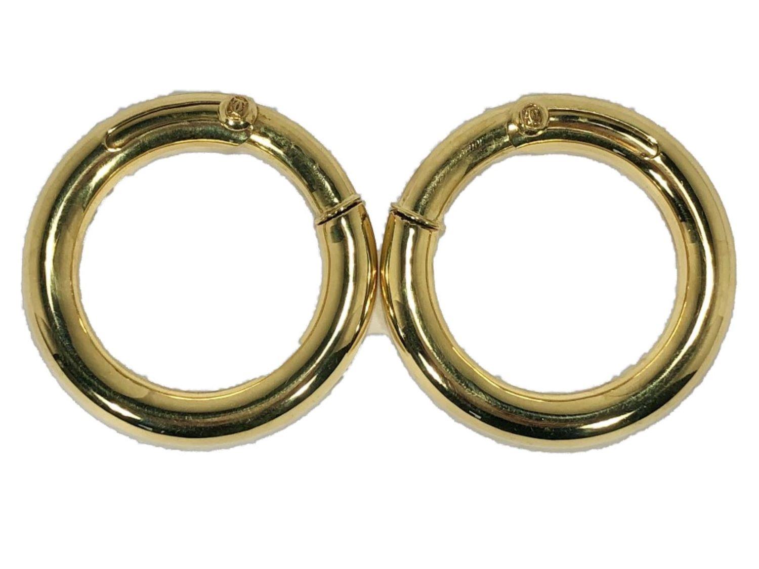 This lovey, classic pair of Cartier 18k high polish hoop earrings are outstanding in quality and size. At 1 5/8 inch outer diameter and a thickness of 6.5mm for the hoop itself, they are not demure.  These are perfect for the lady who does not have
