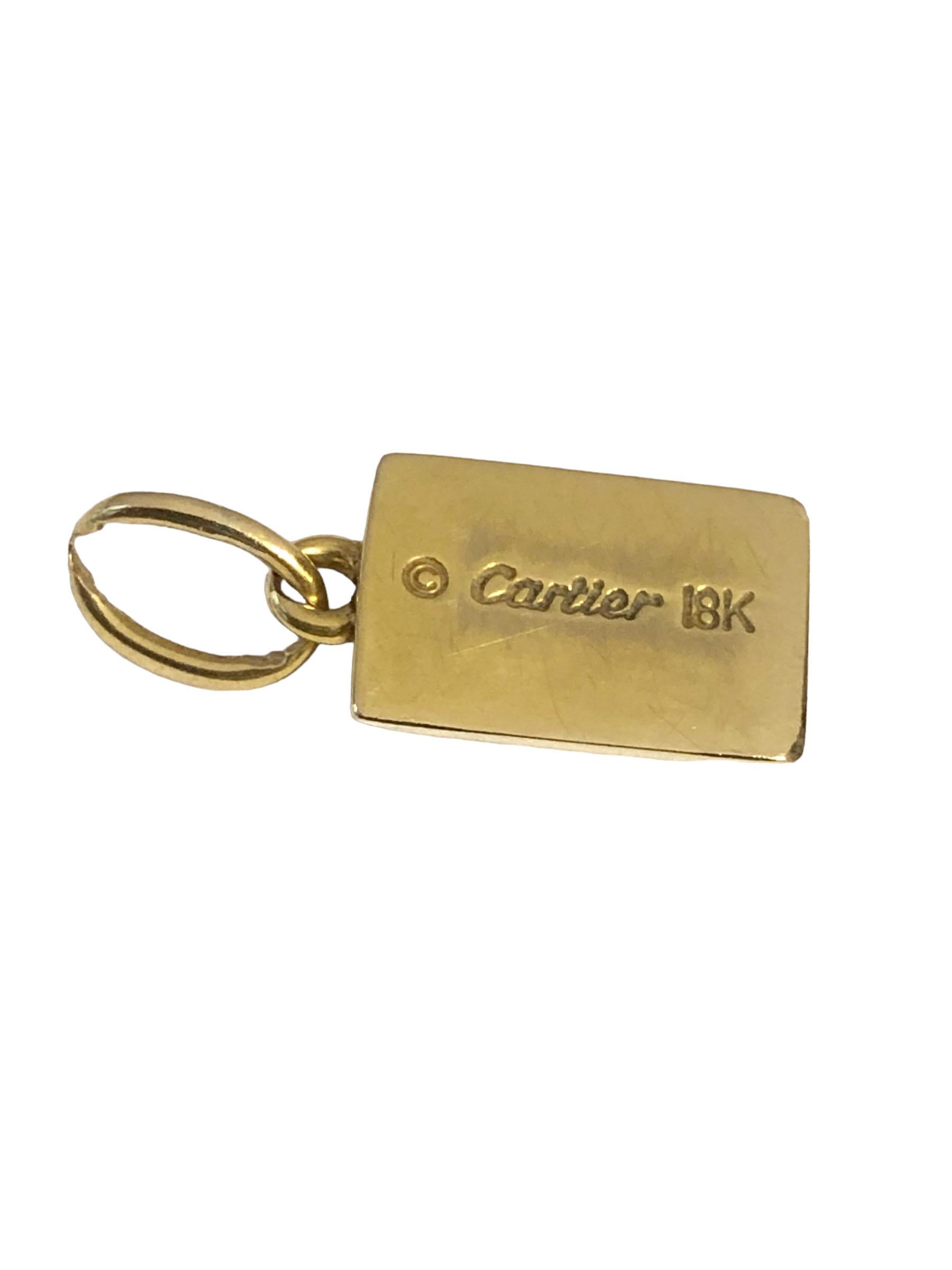 Circa 1980 Cartier 1/8 Ounce 18k Yellow Gold Ingot charm, measuring 1/2 X 3/8 inch. Comes in the original Cartier presentation box.