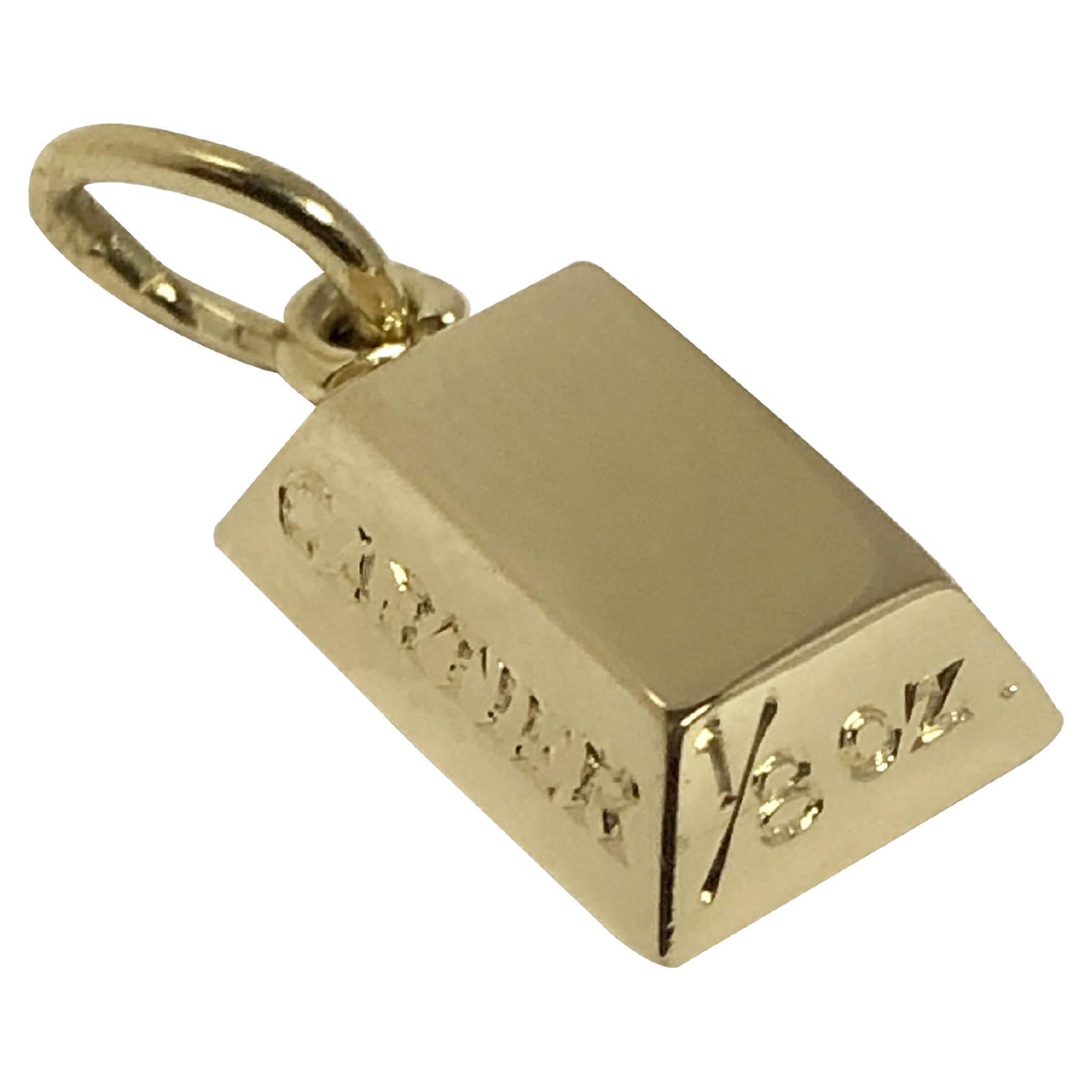 Circa 1980s Cartier 1/8 Oz Gold Ingot Charm, 18k Yellow Gold and measuring 1/2 x 5/16 inch. comes in original presentation box. Excellent and unworn. 