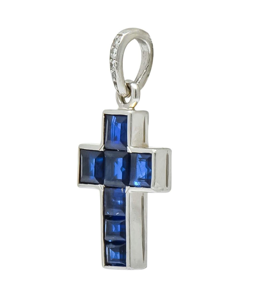 Charm designed as calibré cut sapphire weighing approximately 1.20 carats total, transparent and medium-dark royal blue in color 

Channel set in a platinum frame completed by bale accented by round brilliant cut diamonds weighing approximately 0.05