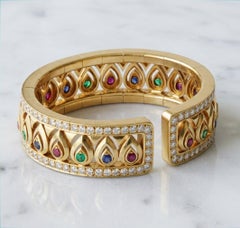 Cartier 13 Carat 18K Gold Diamond & Emerald, Ruby Blue Sapphire Bangle