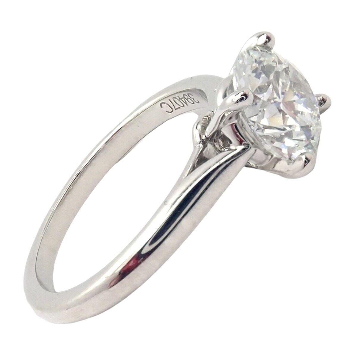 Platinum 1.30ct Diamond Engagement Solitaire Ring by Cartier. 
With 1 round brilliant cut diamond VS1 clarity F color total weight 1.30ct
Cut, Polish, Symmetry Excellent
Fluorescence NONE
This ring comes with GIA certificate for a diamond and a