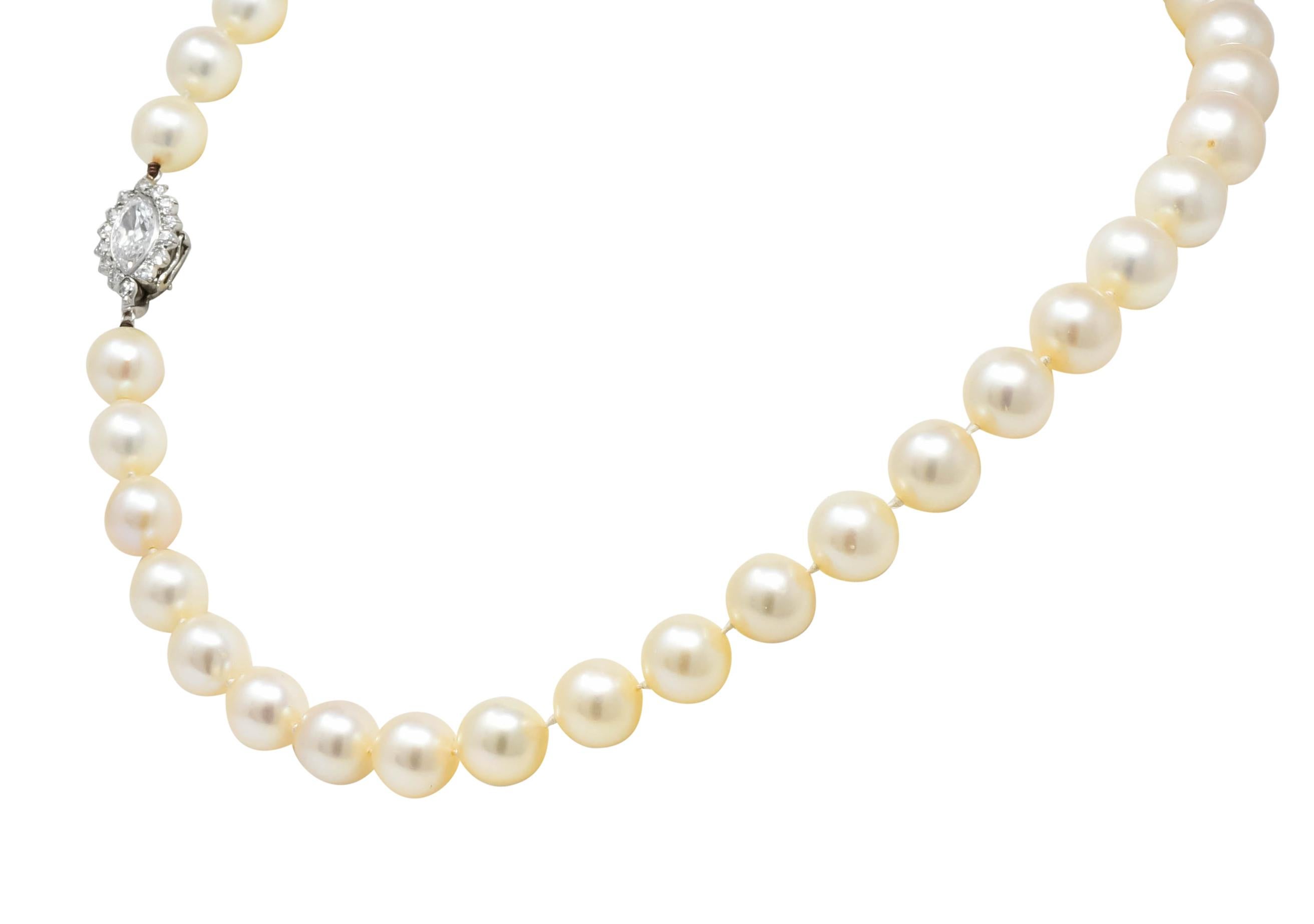 Necklace comprised of thirty-seven cultured pearls measuring approximately 8.4 to 10.2 mm, cream in body color with rosé overtones and good luster

Pearls are hand knotted into a graduated strand completed cluster clasp

Centering a bezel set