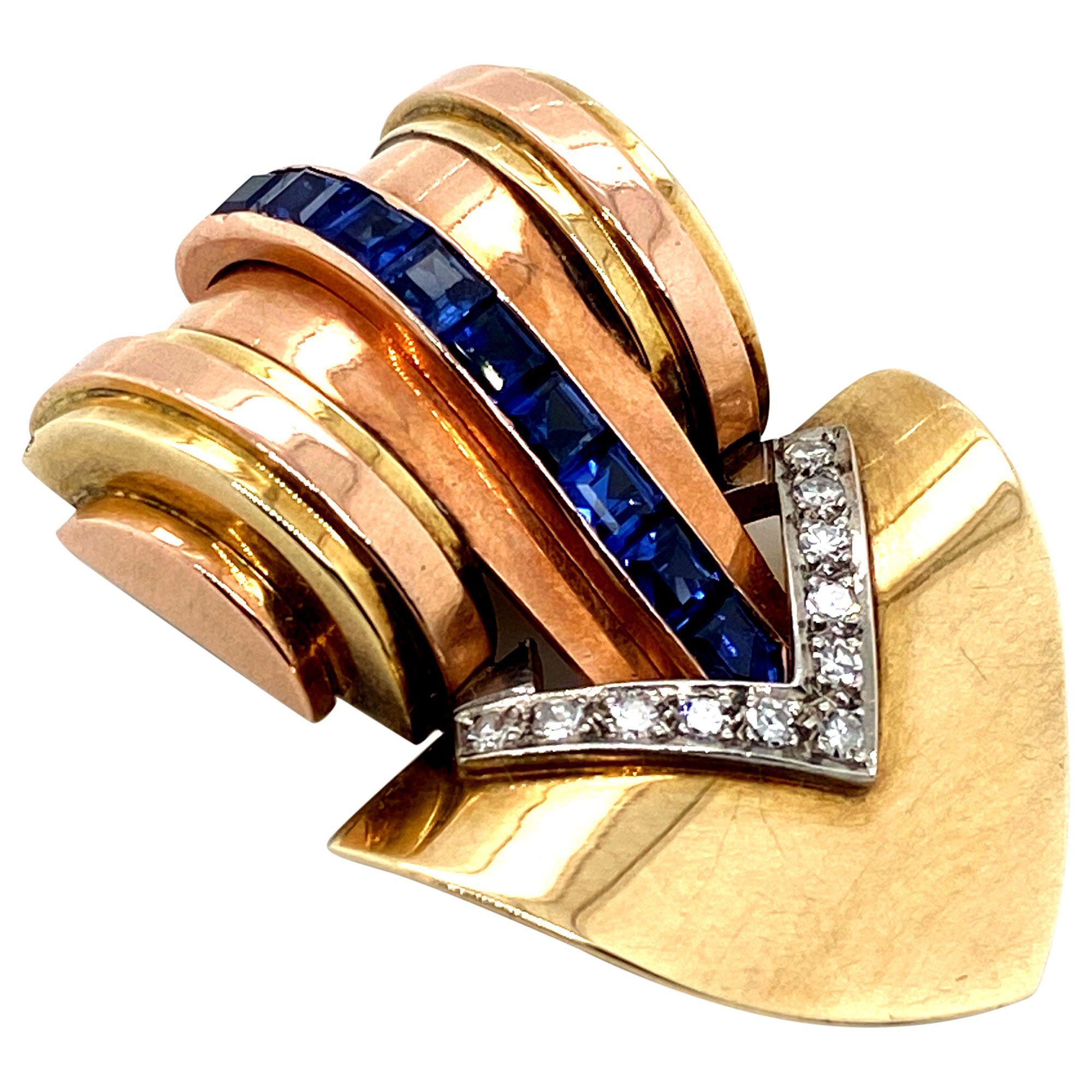 Cartier and Style go together hand in hand and this piece is no exception. Beautifully crafted from the House of Cartier is this fabulous retro 14k gold clip. Set with nine square cut deep blue sapphires which run along the front of the piece and