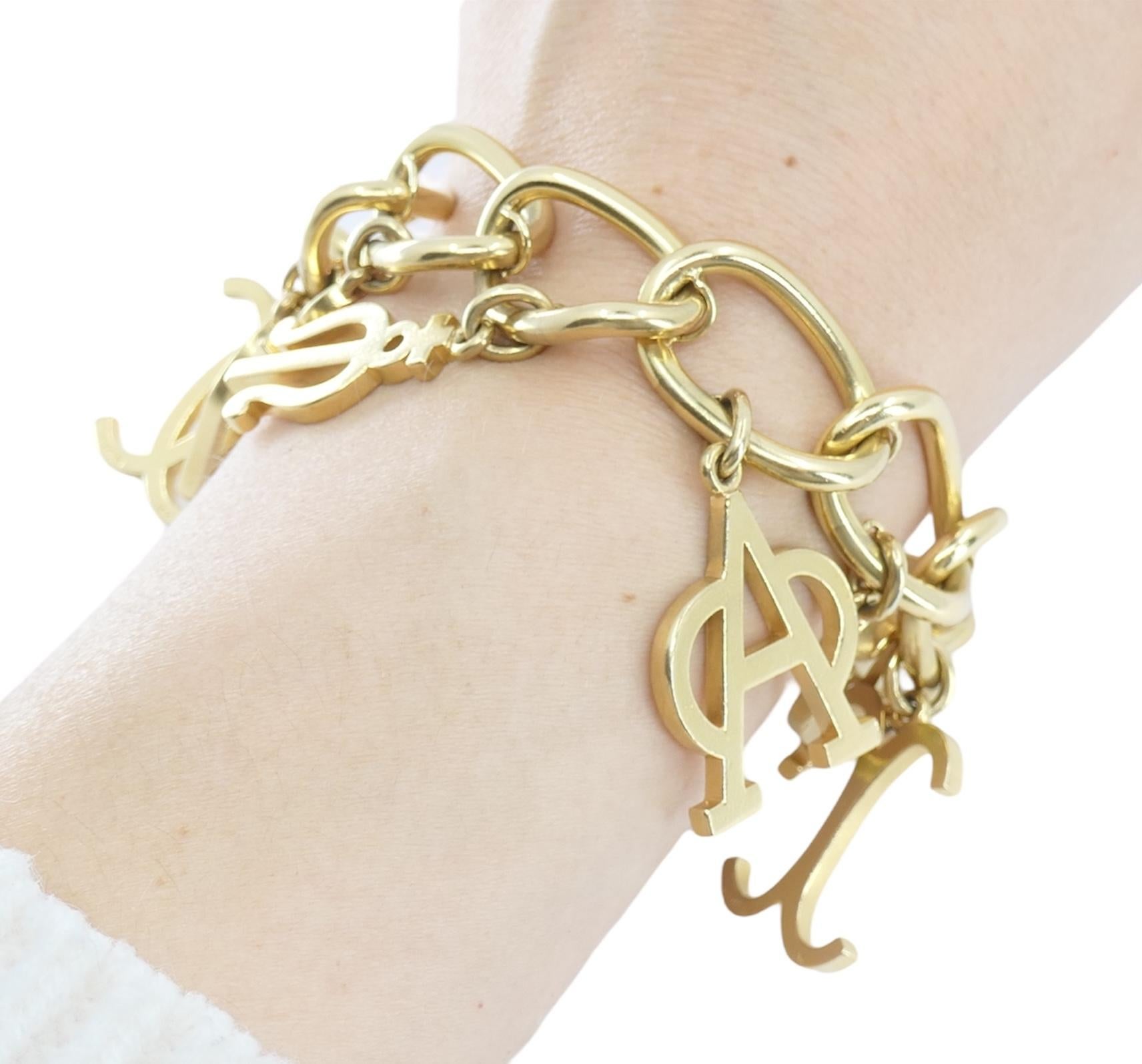 Cartier 14k Gold Charm Bracelet. 7.25