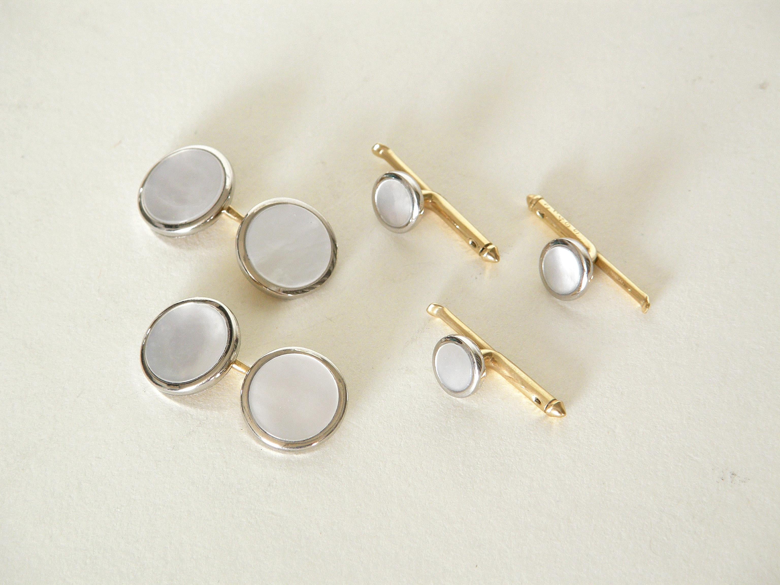 This handsome 14K gold and mother of pearl cufflinks and studs set come in their original Cartier display box. They were made for Cartier by Larter & Sons of Newark, New Jersey. Their style is one of classic, timeless elegance. They're marked 14K