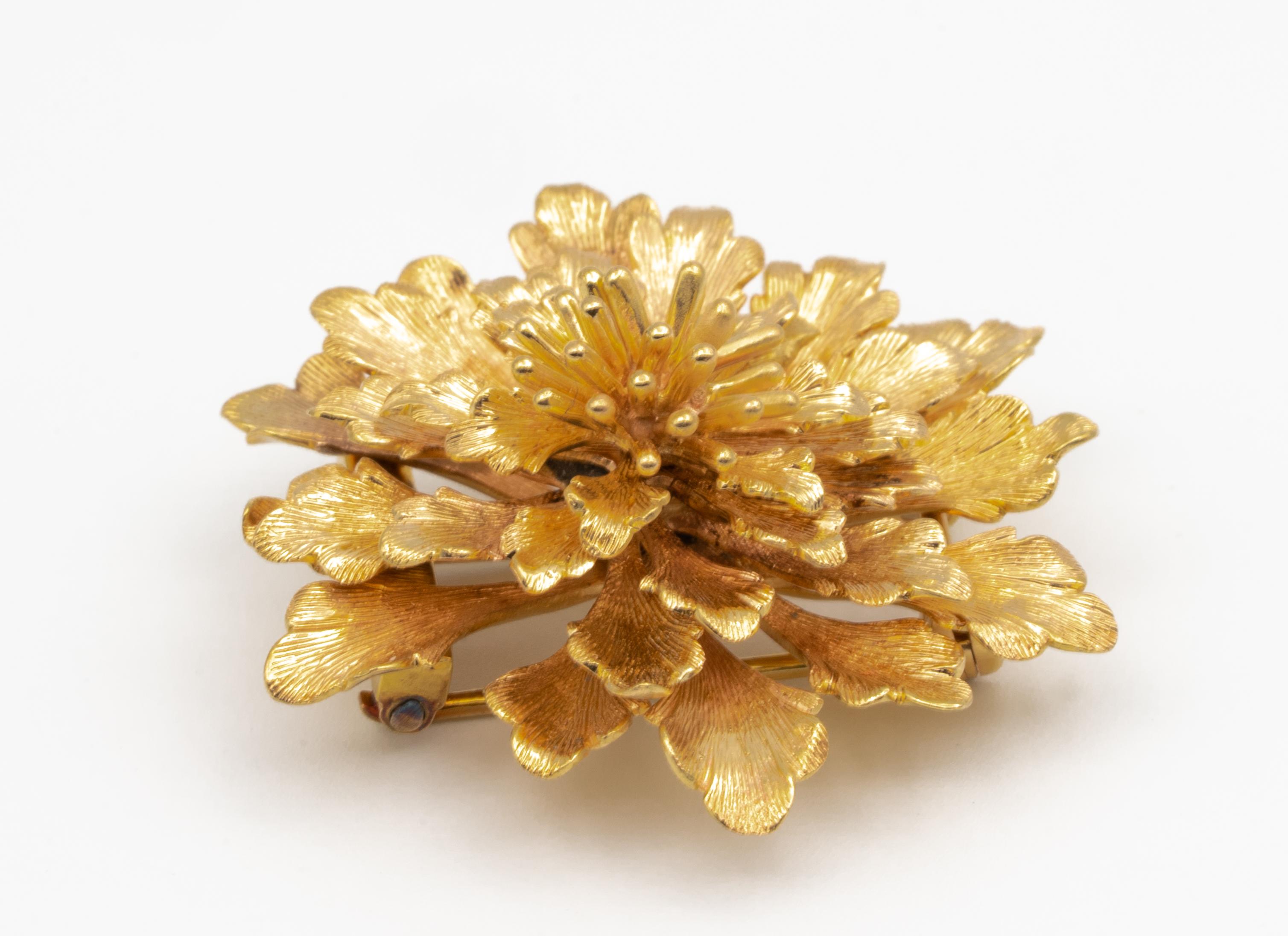 Vintage Cartier Gold Flower Clip-Brooch finely crafted in 14 Karat gold, signed by Cartier with approximate weight of 15.5 grams. The brooch has a double pin closure.

Stamp: CARTIER 14K
Weight: 15.5 grams