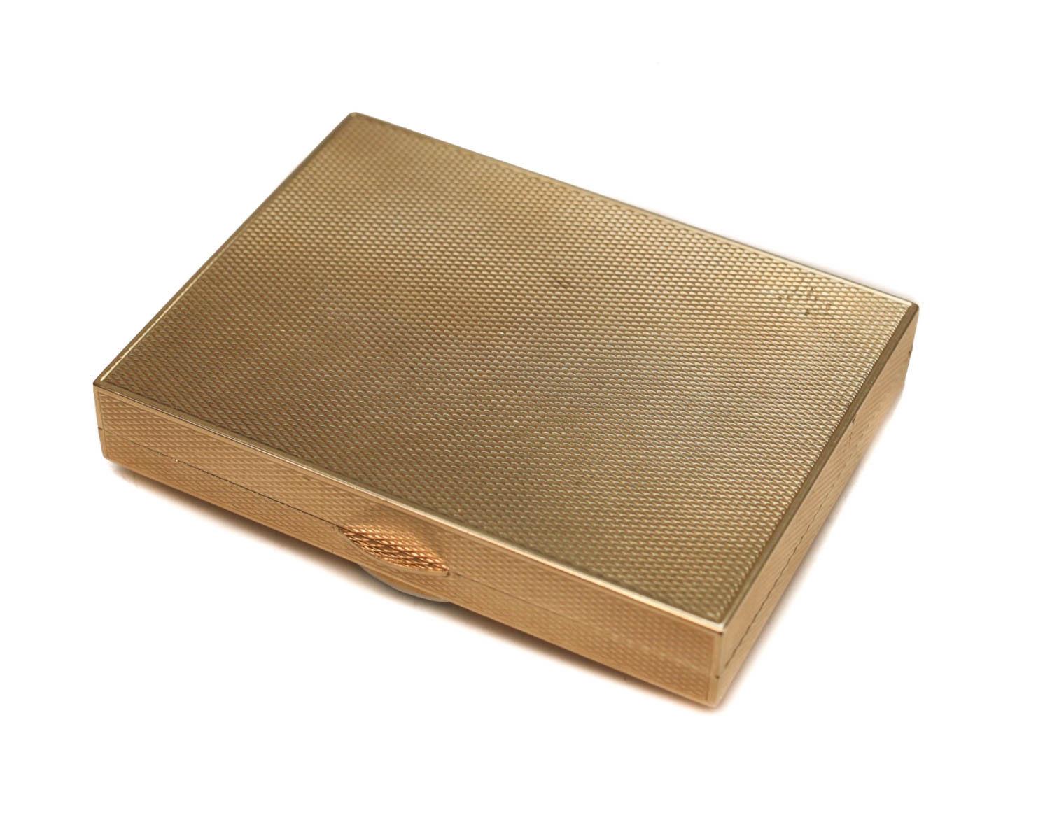 Cartier 14-karat yellow gold and 0.75-carat F-G color VVS clarity diamond compact powder box, circa 1940. Engine turned texture throughout the box with an applied diamond starburst design towards to the lid. Cartier gold marks to the inner lid.