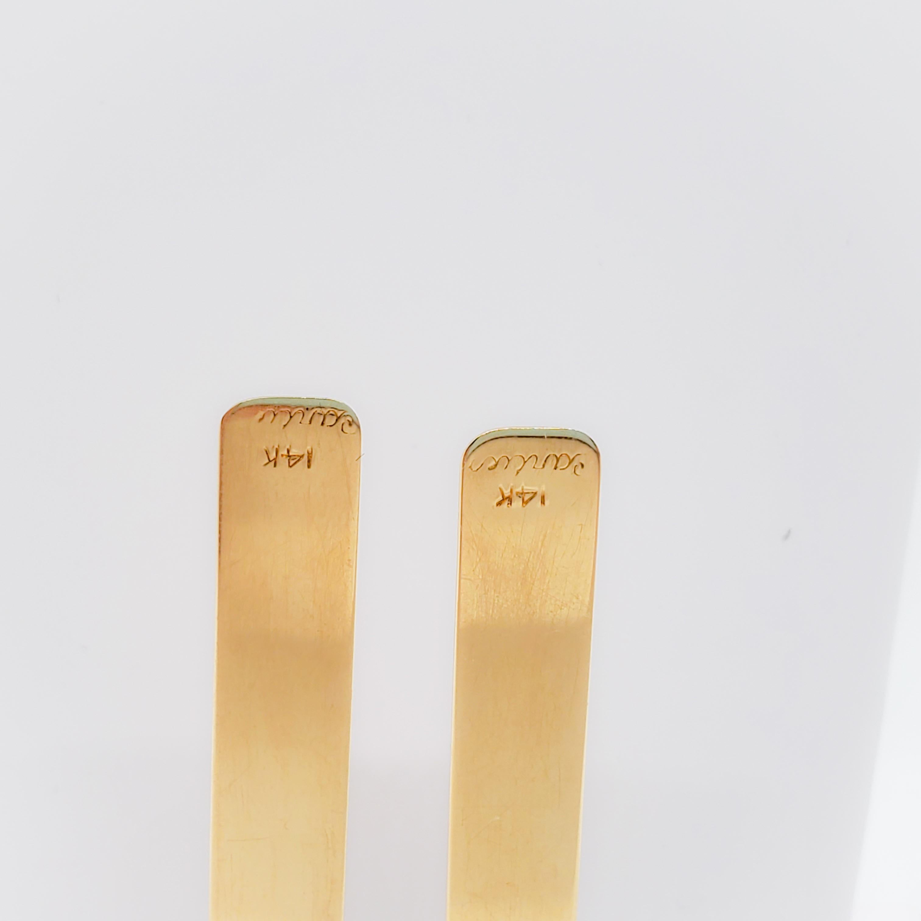 Classic and simple Cartier collar stays in 14k yellow gold.  