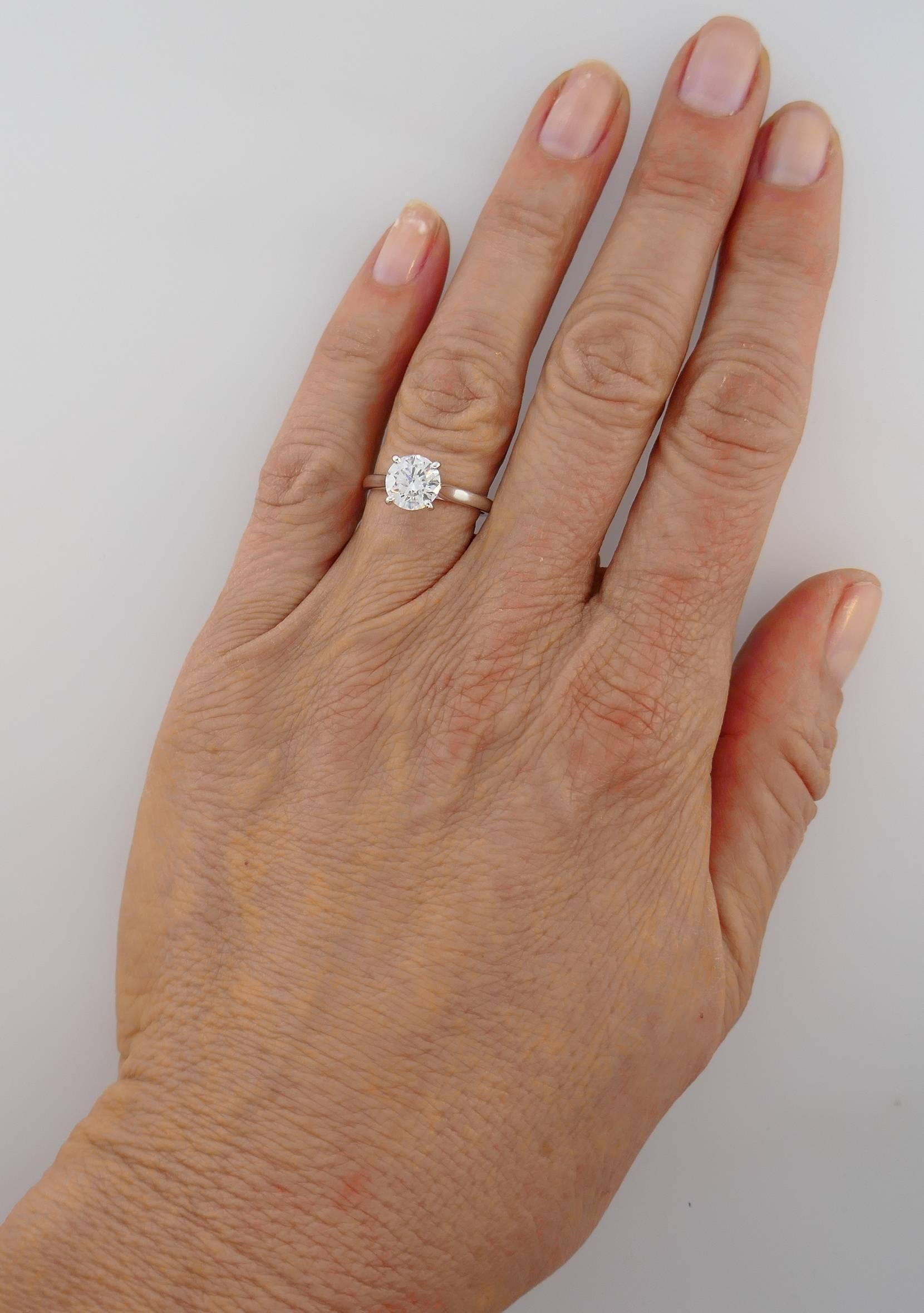 Classic solitaire diamond engagement ring. This solitaire has been a Cartier classic since 1895. The elegance of the lines is unique, the refined and open setting allows the light of the diamond to flow freely. Features a 1.50-carat round brilliant