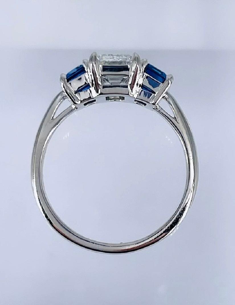 Cartier 1.55 carat GIA FVVS1 Emerald Cut Diamond Three Stone Ring with Sapphires In Excellent Condition For Sale In New York, NY