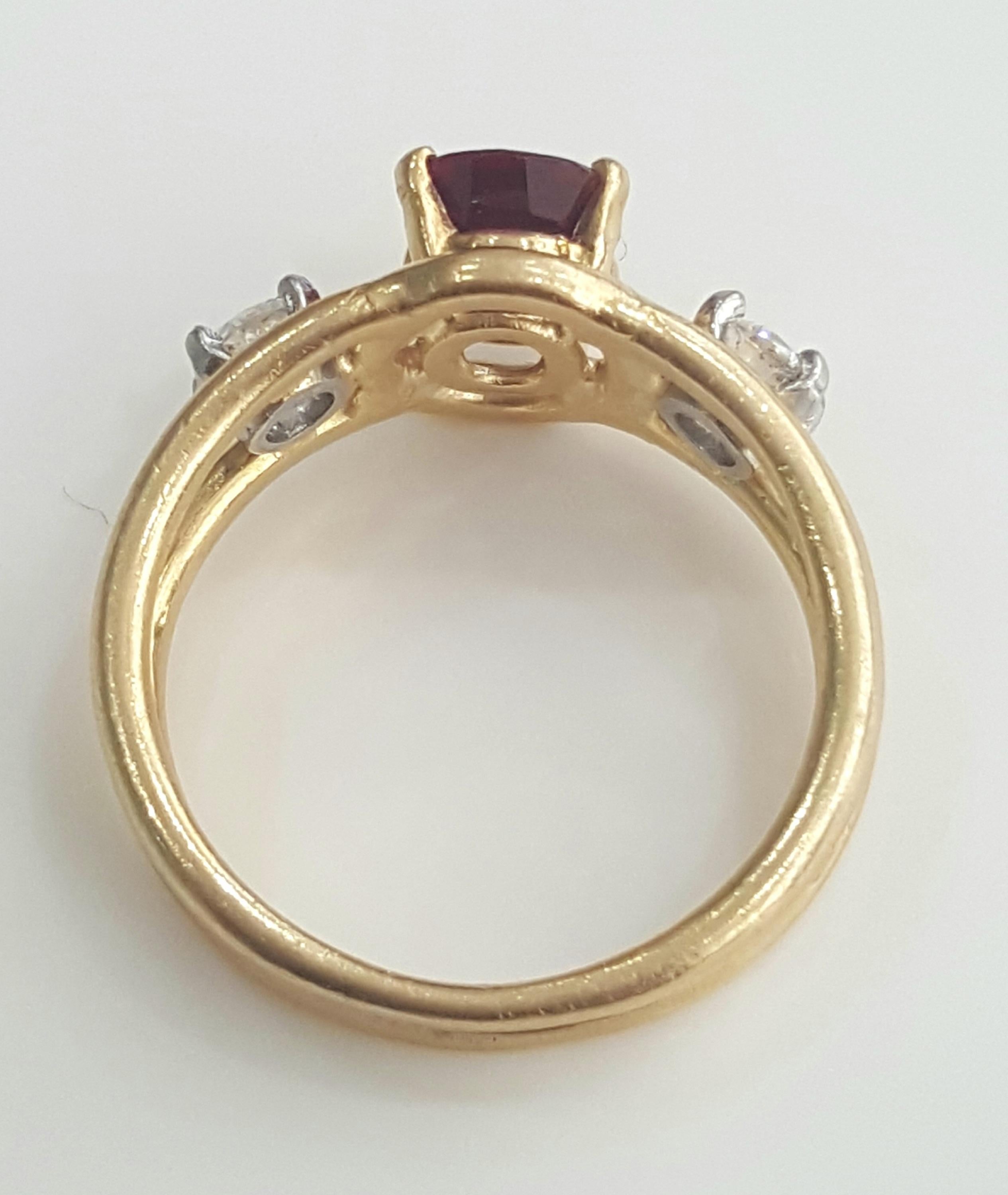 Women's or Men's  Cartier 1.70 Carat Natural Oval Ruby Heat and White Diamond Ring in 18 Karat.