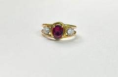  Cartier 1.70 Carat Natural Oval Ruby Heat and White Diamond Ring in 18 Karat.