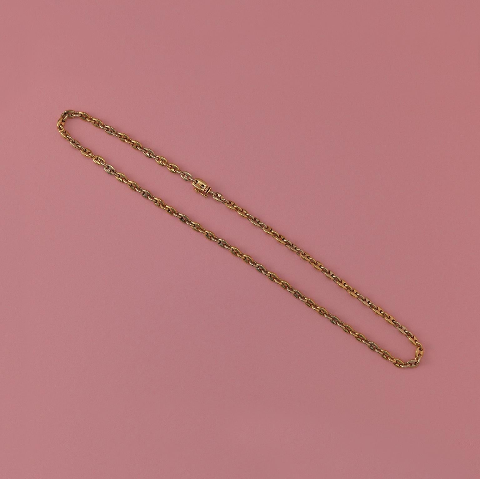A vintage bi-color 18 carat gold coffee bean chain, signed and numbered: Cartier, 709927.

length: 45.5 cm
weight: 39.91 grams
width: 5 mm