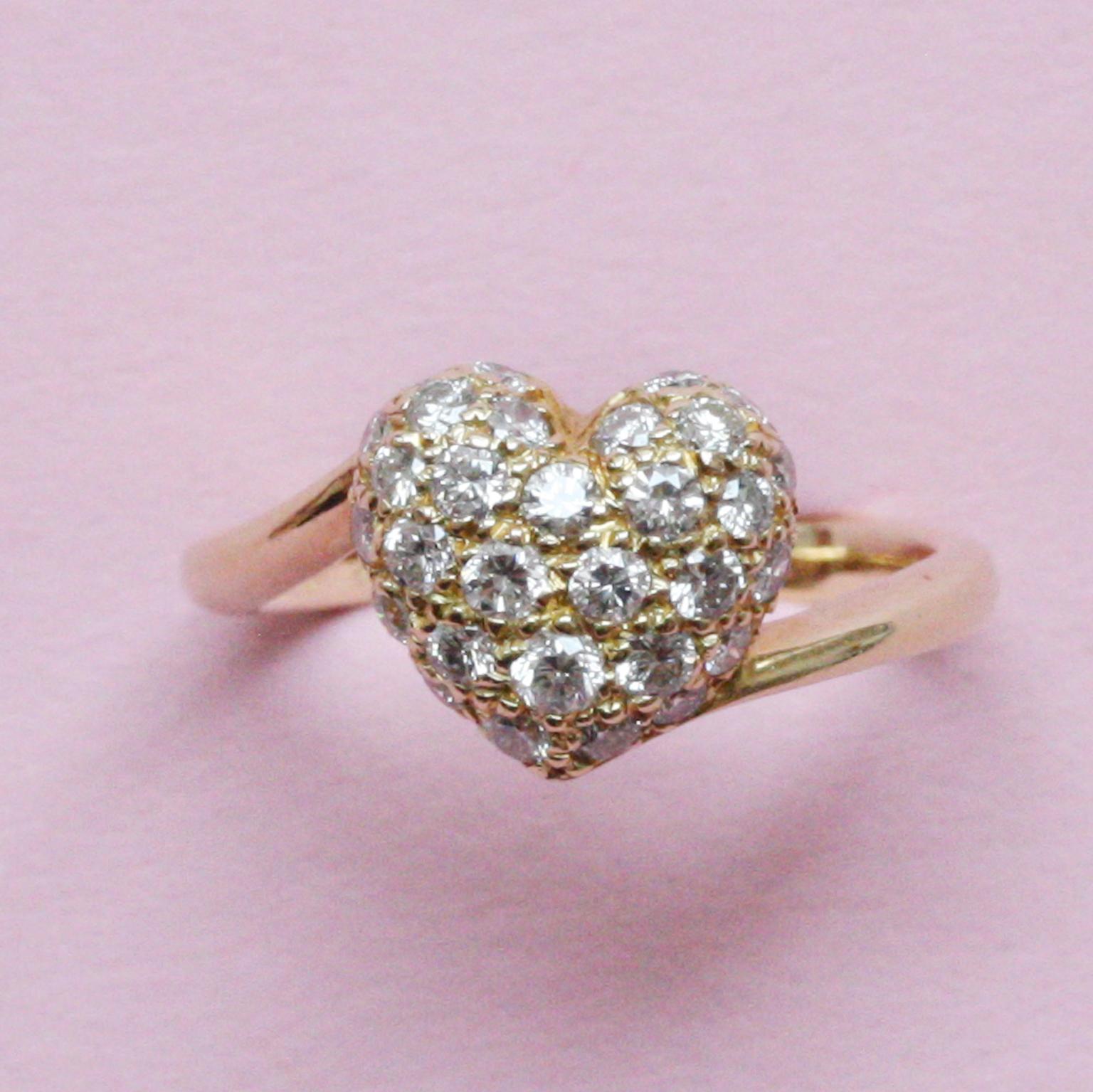 An 18 carat gold ring with a puffy heart set with brilliant cut diamonds (app. 0.5 carat in total), signed and numbered: Cartier, 281 444 47.

ring size 15.5 mm. / 4 ¾+ 5- US.
weight: 3.26 gram
witdth: 2 - 5 mm.