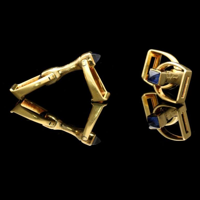 4 x sugar loaf cabochon sapphires estimated to weigh a combined total of approximately 1.2 Carats
18ct yellow gold signed Cartier and numbered, with French assay marks
4cm long, 1.3cm wide
11.7 grams

An elegant pair of gold and sapphire stirrup